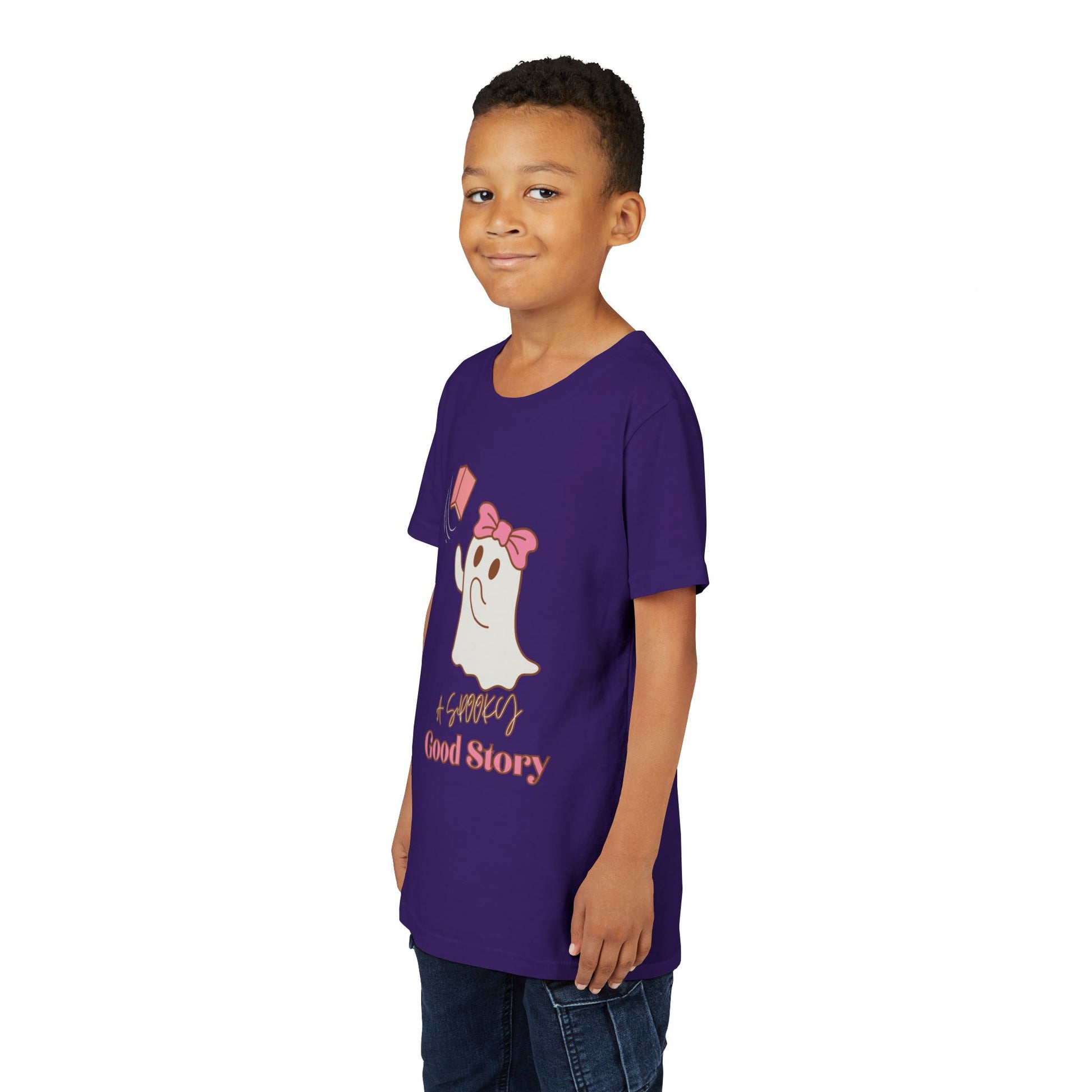 Boy wearing a purple t-shirt with ghost trying to catch a haunted book and text 'A Spooky Good Story'