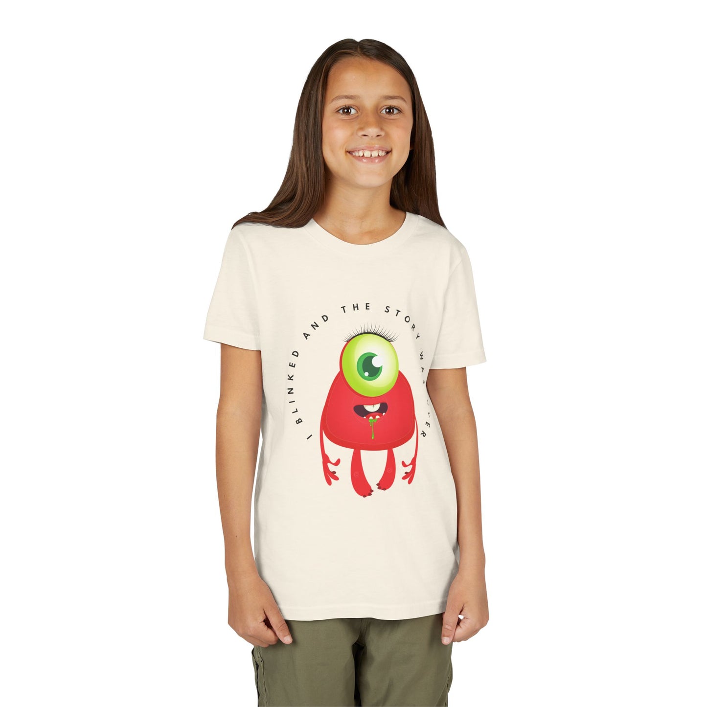 Girl wearing a beige t-shirt with a one eye, red, drooling monster and text 'I Blinked And The Story Was Over' 