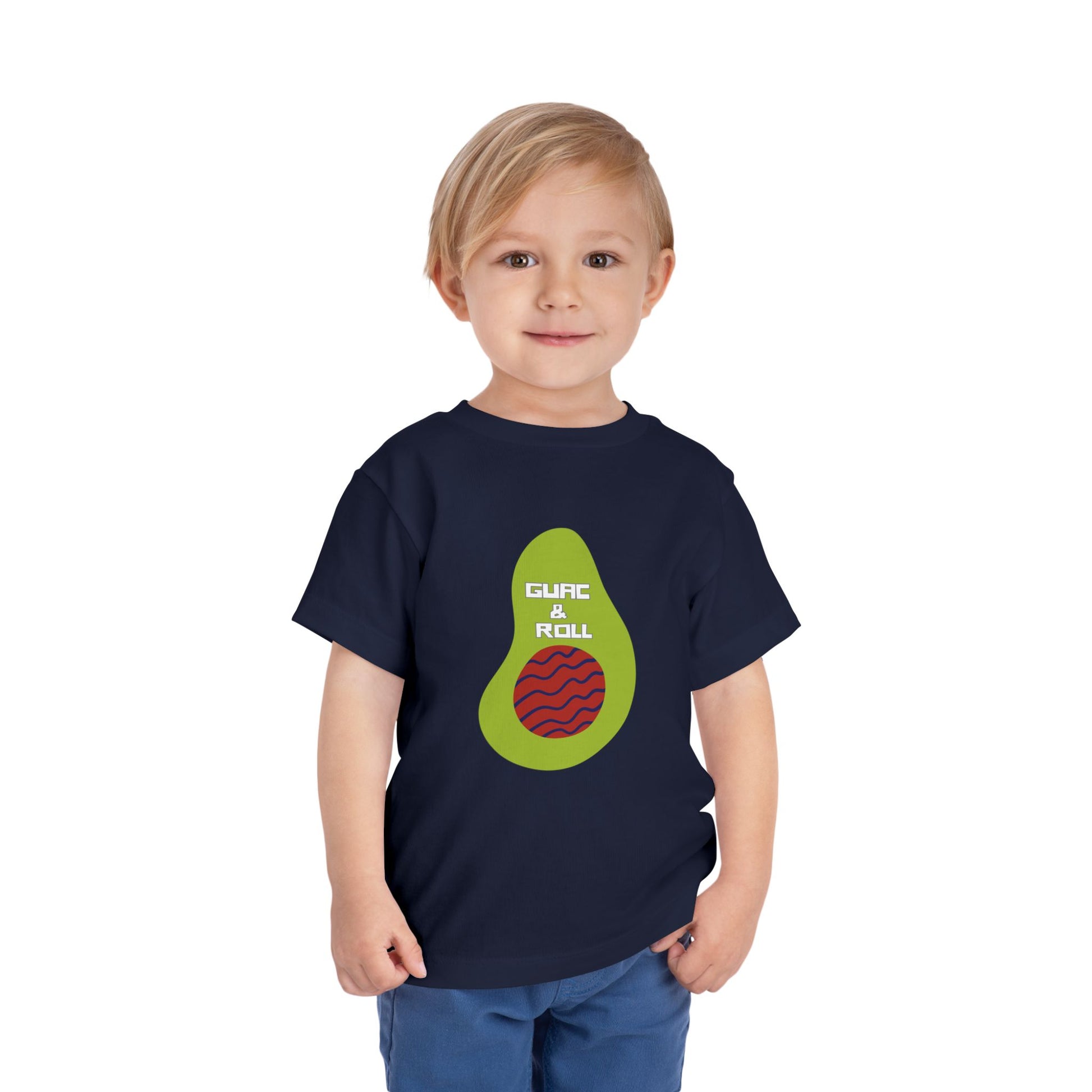 Toddler wearing a navy blue t-shirt with avocado graphic and 'Guac & Roll' text 