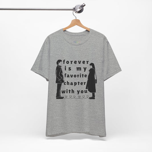 Gray t-shirt with black graphics of a man and woman facing each other and in between is text 'Forever Is My Favorite Chapter With You'