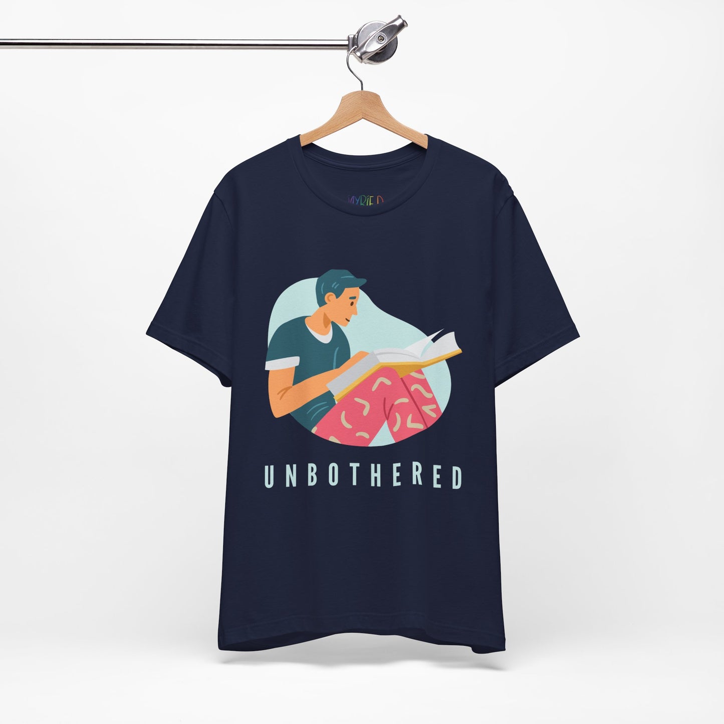 Navy blue t-shirt with a man reading a book and 'UNBOTHERED' text 