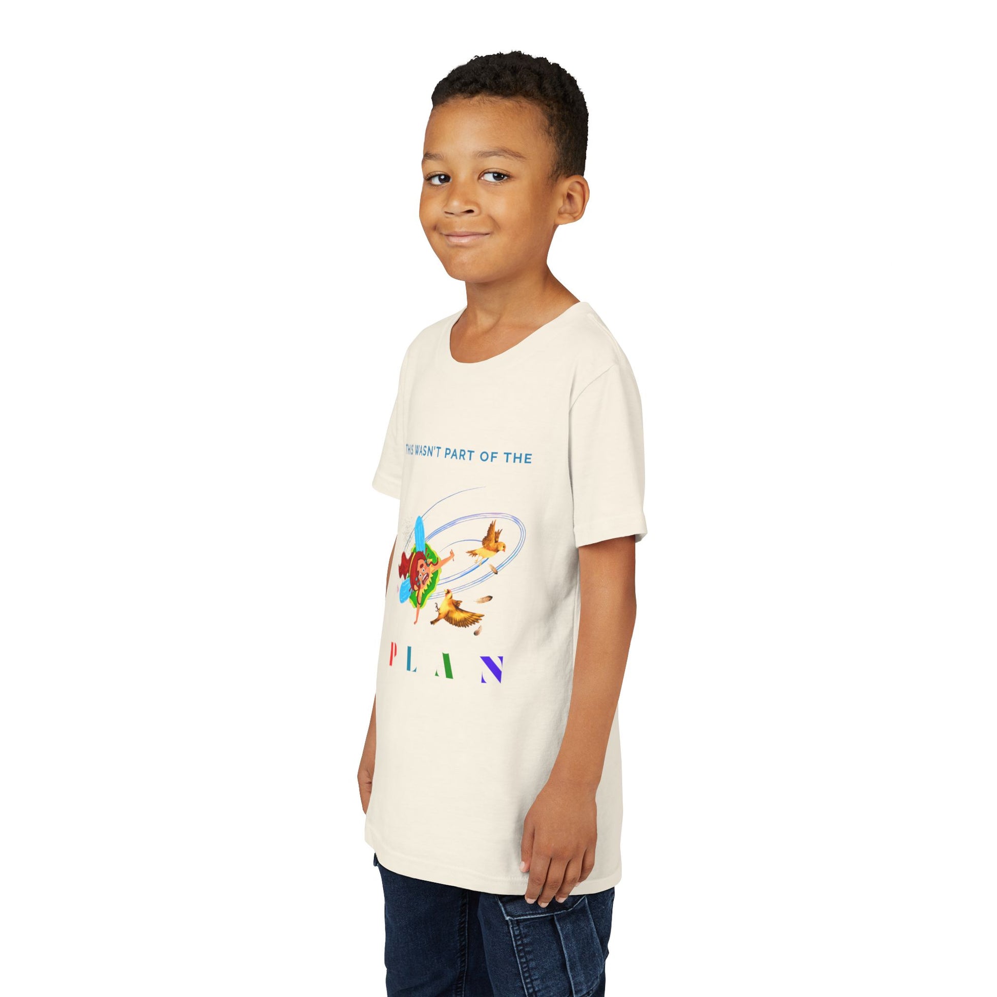 Boy wearing a beige t-shirt with colorful graphic of a fairy crashing into birds mid air and text 'This Wasn't Part Of The PLAN'