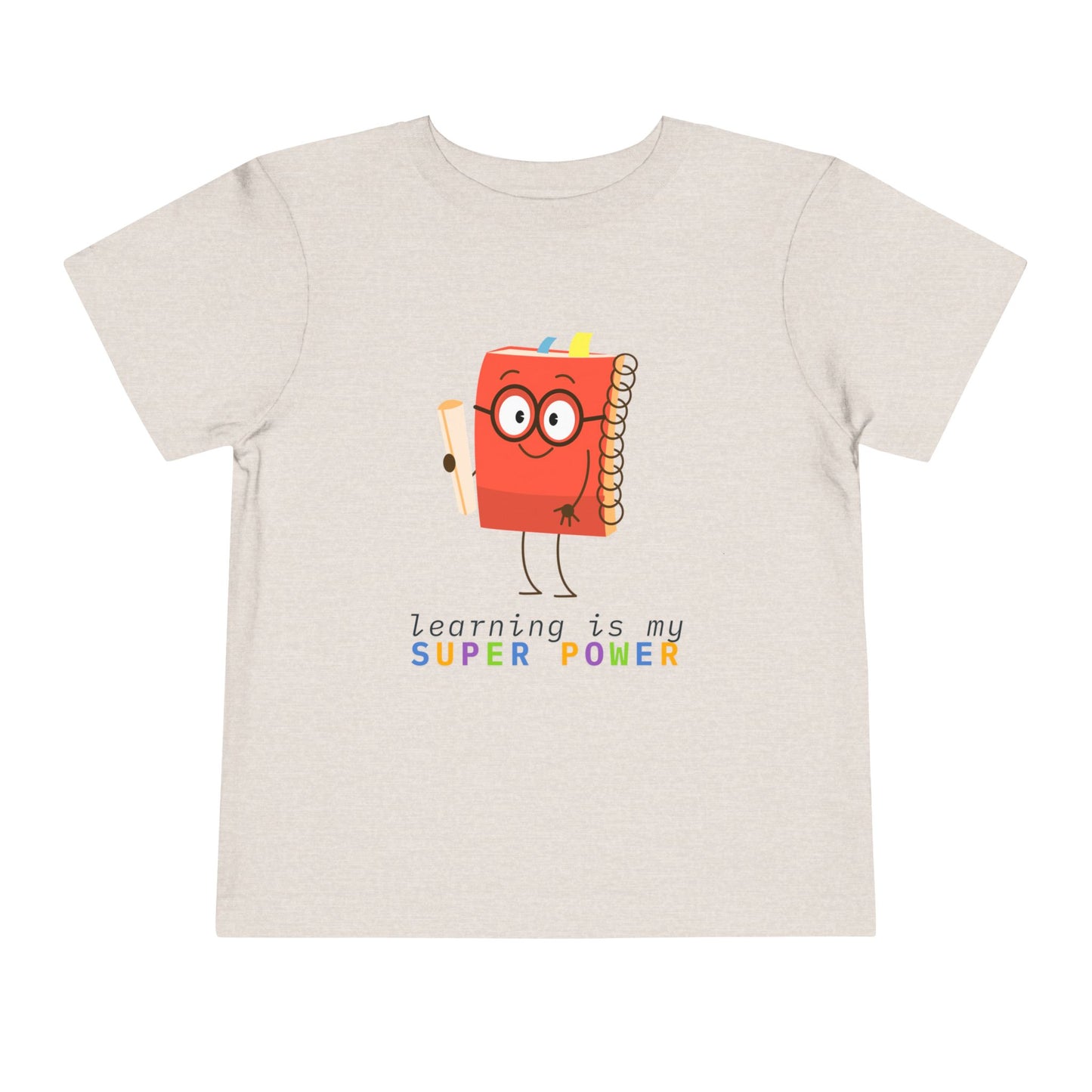 Tan toddler t-shirt with a cartoon book character and colorful 'learning is my super power' text 