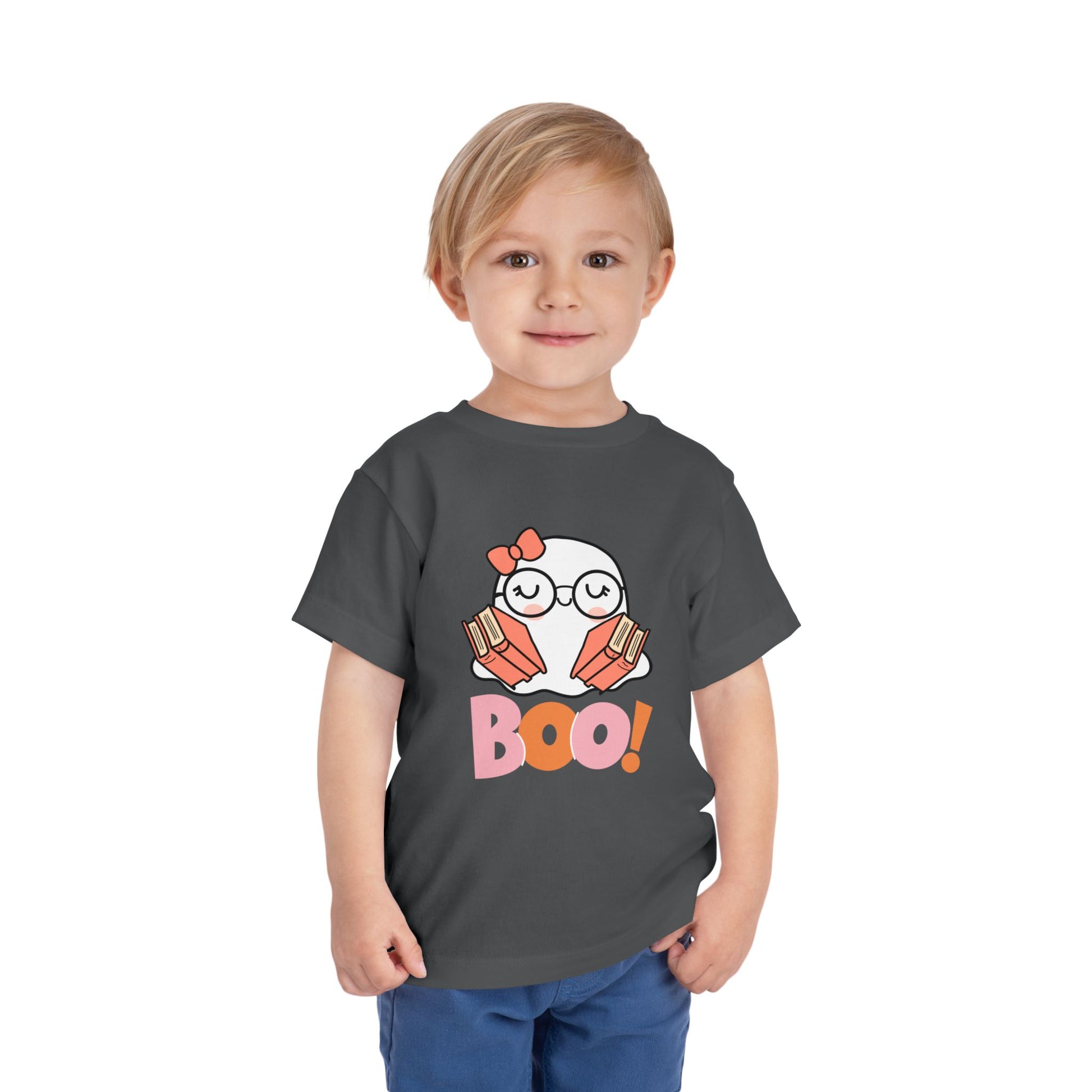 Toddler wearing a gray t-shirt with a ghost holding books in each arm and large 'BOO!' text 