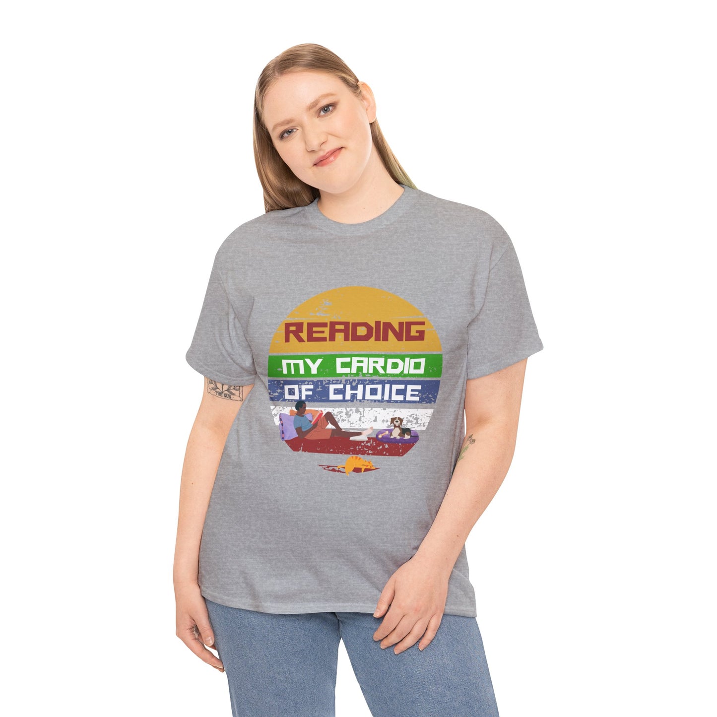 Woman wearing a gray retro t-shirt with a colorful striped circle featuring a man reading a book alongside his dog and cat, and text 'Reading, My Cardio Of Choice' 