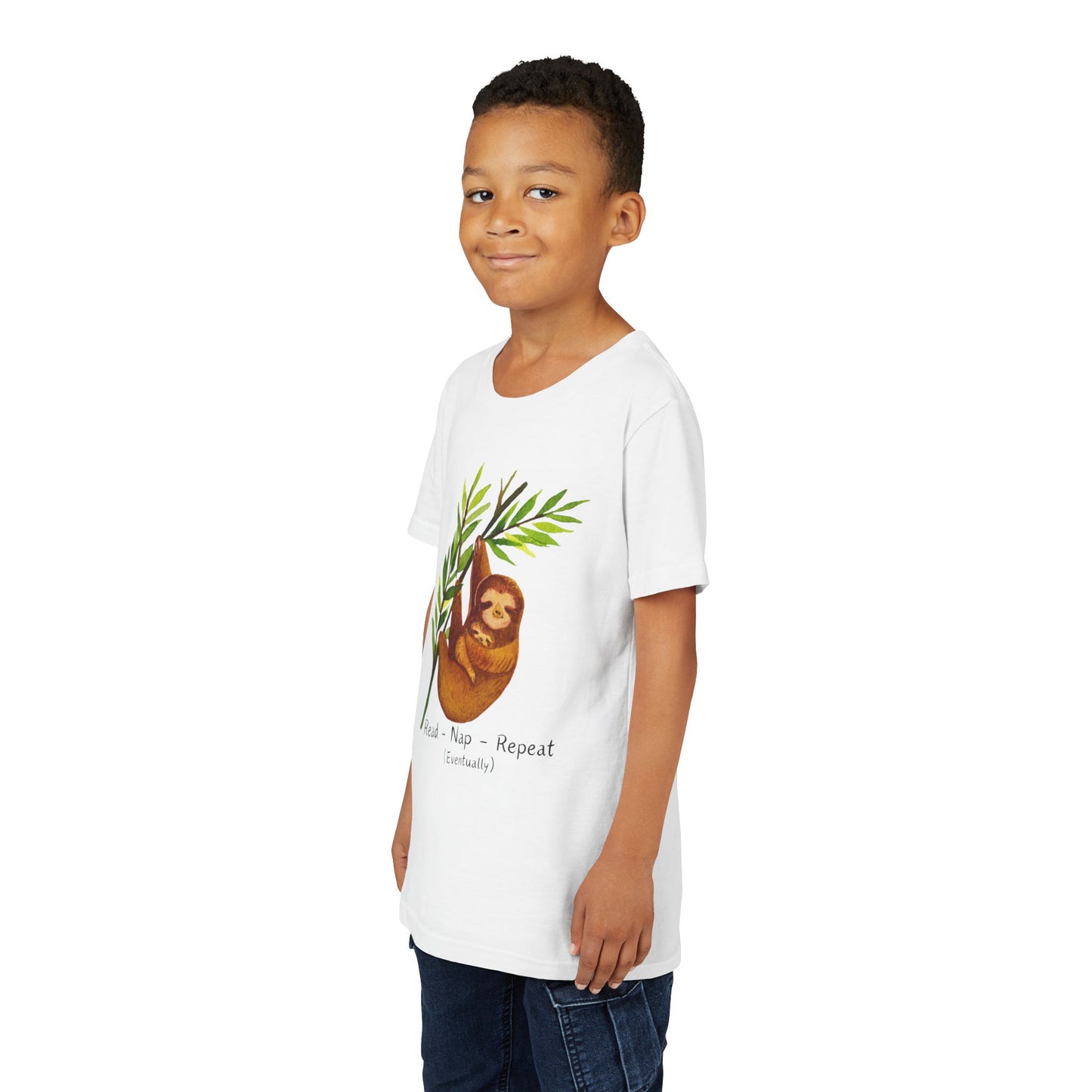 Boy wearing a white sloth t-shirt with a and text 'Read. Nap. Repeat. (Eventually)'