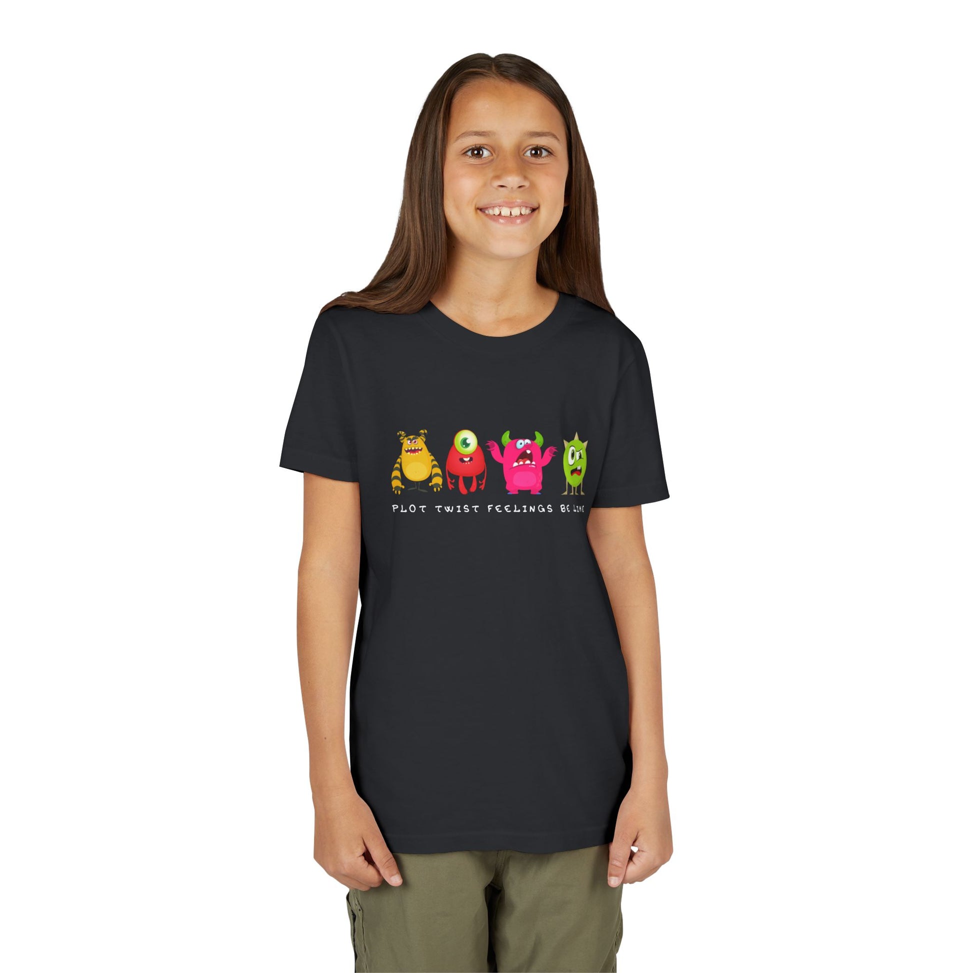 Girl wearing a black t-shirt with a row of frustrated and colorful cartoon monsters, text 'Plot Twists Feelings Be Like'