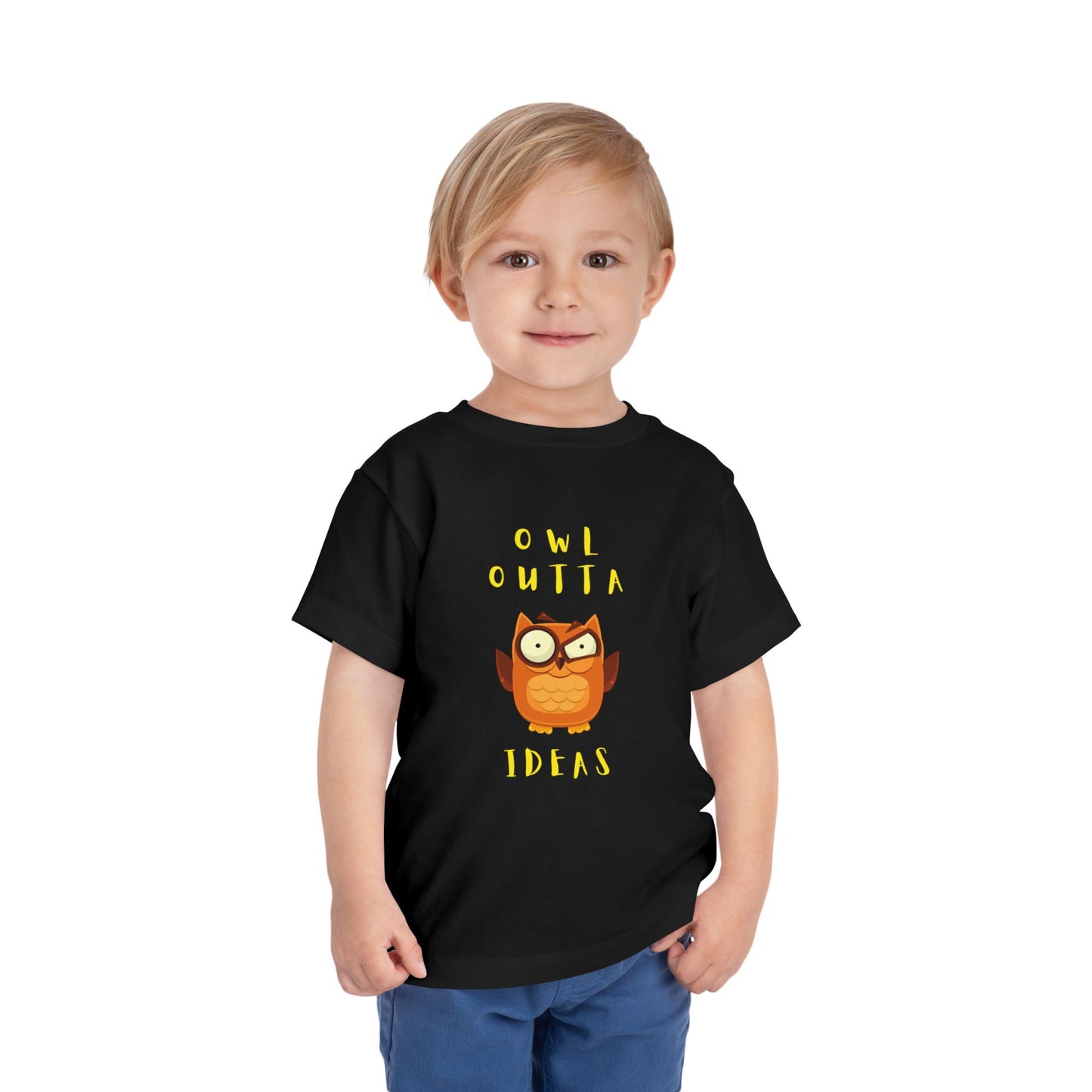 Toddler wearing a black t-shirt with an flustered owl graphic and text 'Owl Outta Ideas'