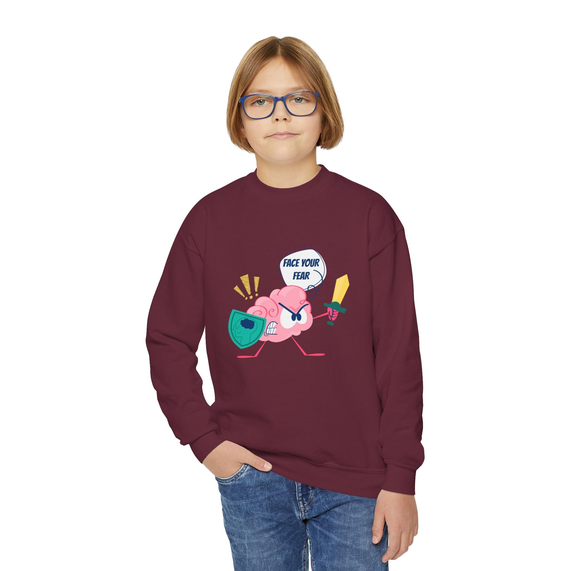 Boy wearing a maroon sweatshirt with a cartoon brain holding a shield and sword, text 'Face Your Fear' 