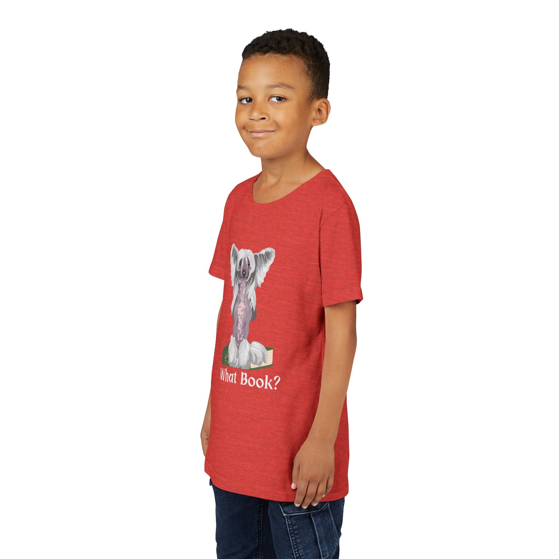 Boy wearing a red t-shirt with a graphic of a dog sitting on a book and text 'What Book?' 