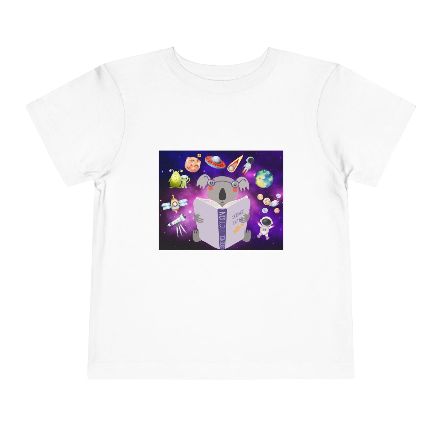White toddler t-shirt with a colorful graphic of a koala reading a book, with all sorts of space ideas floating around 