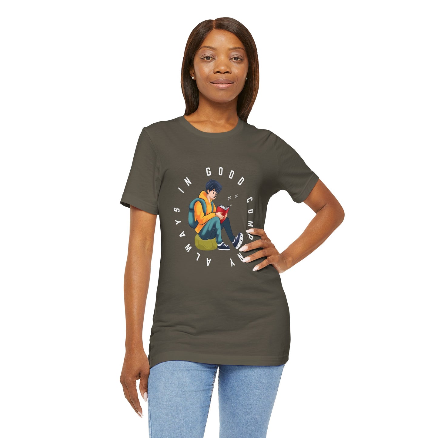 Woman wearing an army green t-shirt with a graphic design of a person reading a book, sitting on a green bag, with text 'Always In Good Company' 