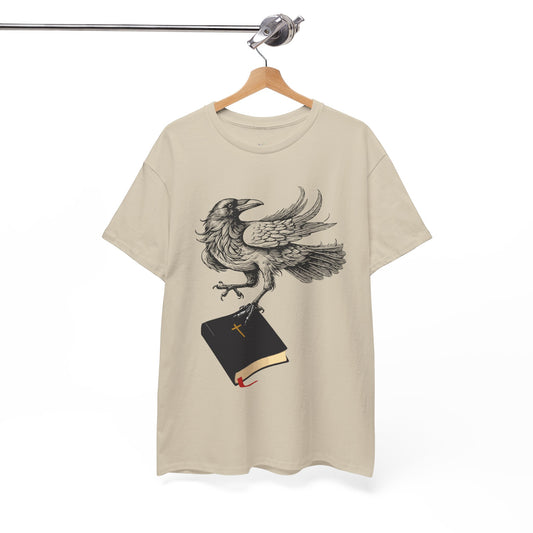 Tan t-shirt with a crow carying a bible, a shirt on a hanger against a white background