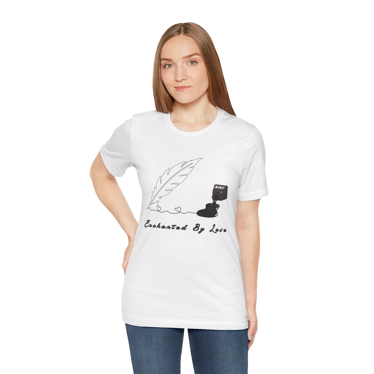 Woman wearing a white t-shirt with a black sketched feather quill, spilled ink and text 'Enchanted By Love'