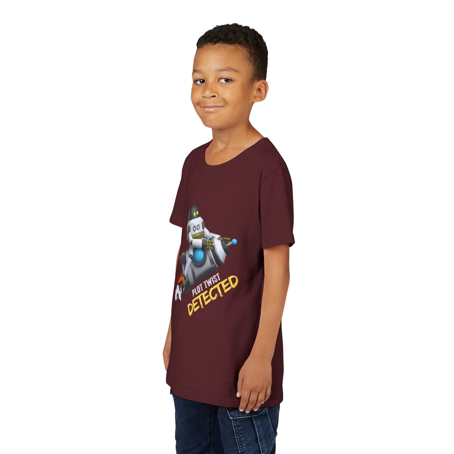 Boy wearing a maroon t-shirt with robot riding a rocket and text 'Plot Twist Detected' 