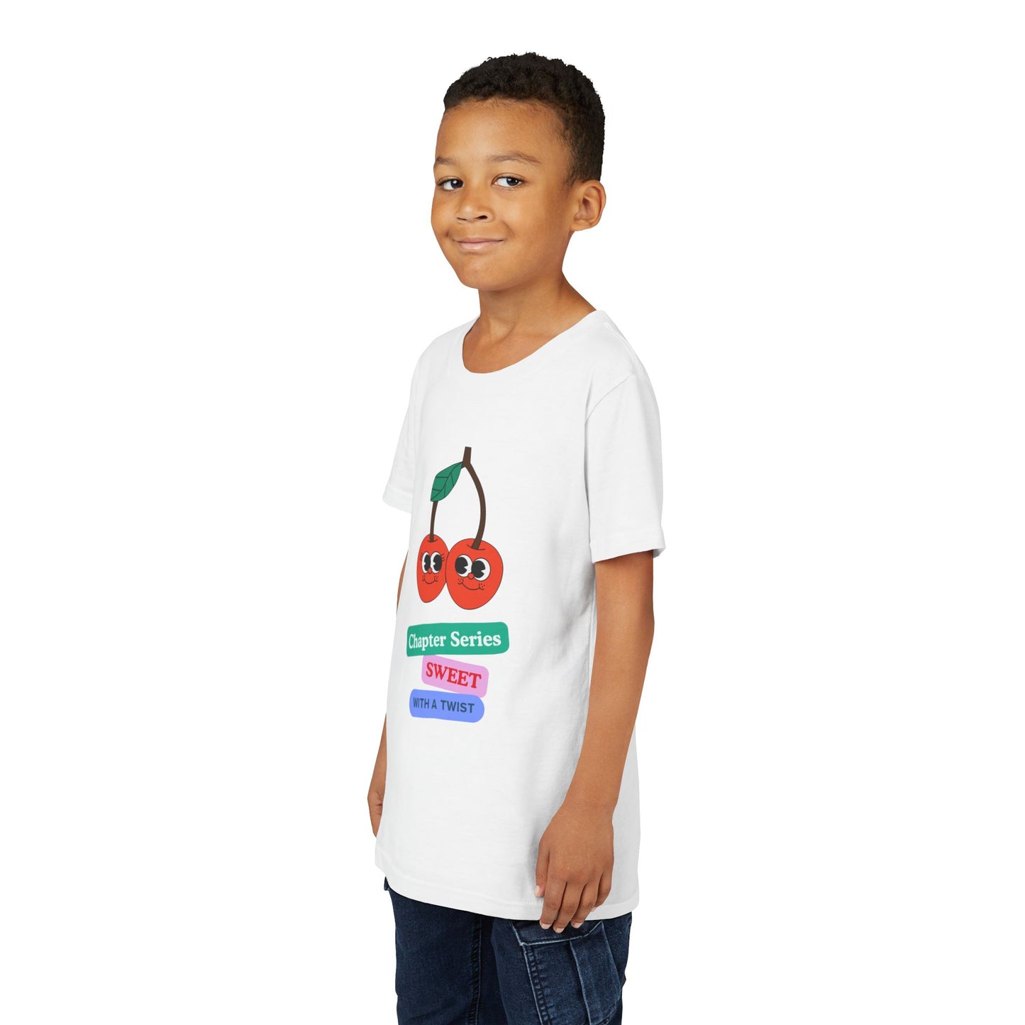 Boy wearing a white t-shirt with a smiling cherry graphic and text 'Chapter Series SWEET With A Twist'