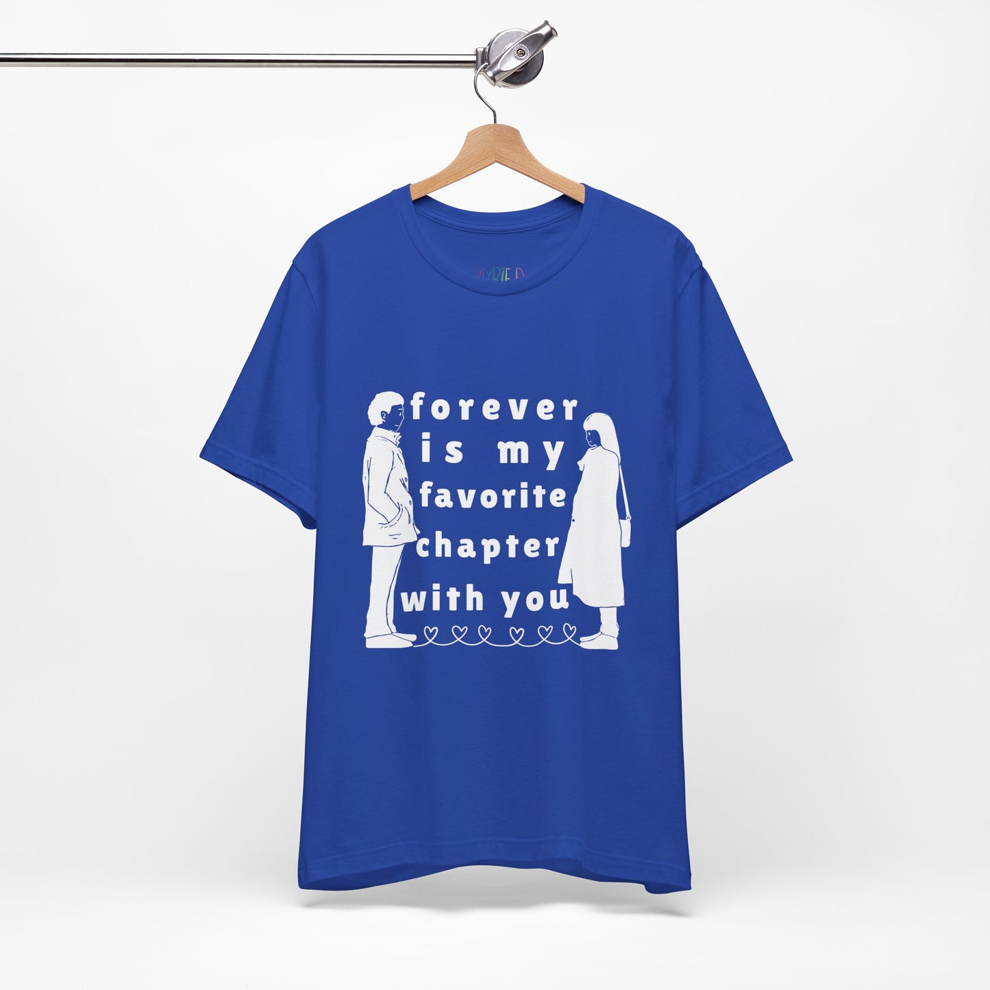 Blue t-shirt with white graphics of a man and woman facing each other and in between is text 'Forever Is My Favorite Chapter With You'