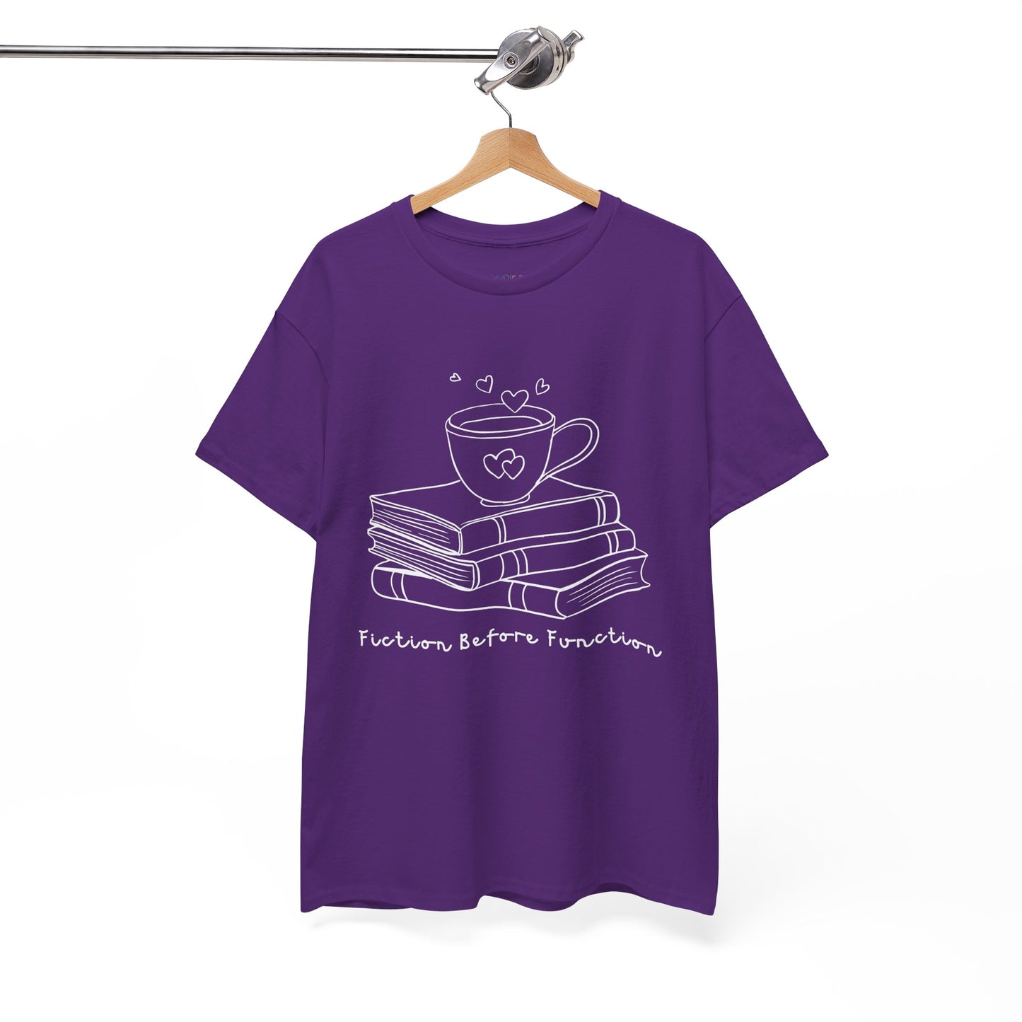 Purple t-shirt with white graphic design of hot beverage and a stack of books, text 'Fiction Before Function' 