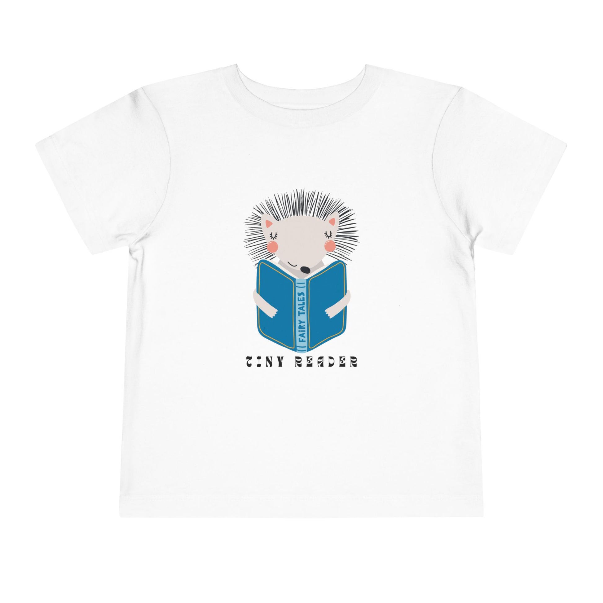 White t-shirt with a hedgehog reading a book graphic and 'Tiny Reader' text