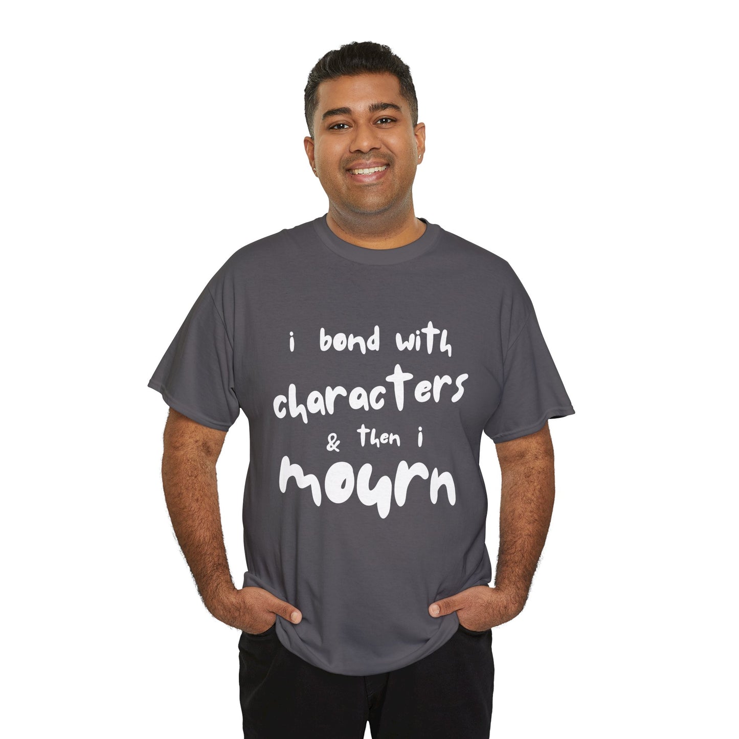 Man wearing a gray t-shirt with exaggerated sized letters and text 'I Bond With Characters & Then I Mourn'
