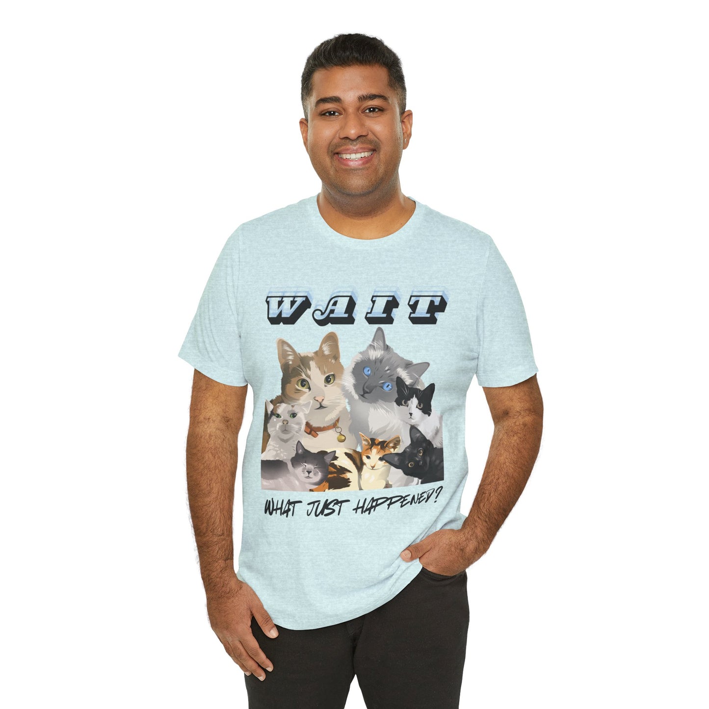 Man wearing an ice blue t-shirt with all sorts of cats leaning in and text 'WAIT WHAT JUST HAPPENED'