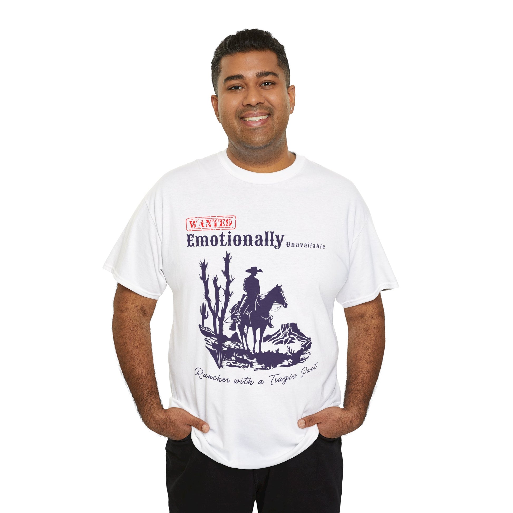 Man wearing a white t-shirt with a horse riding cowboy in a desert setting and text 'WANTED Emotionally Unavailable Rancher With A Tragic Past'