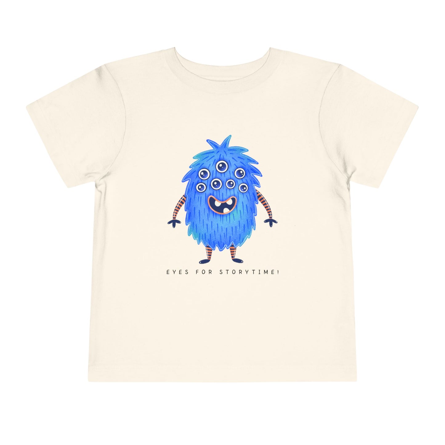 Beige toddler t-shirt with a blue multi-eyed cartoon monster and text 'eyes for storytime!'