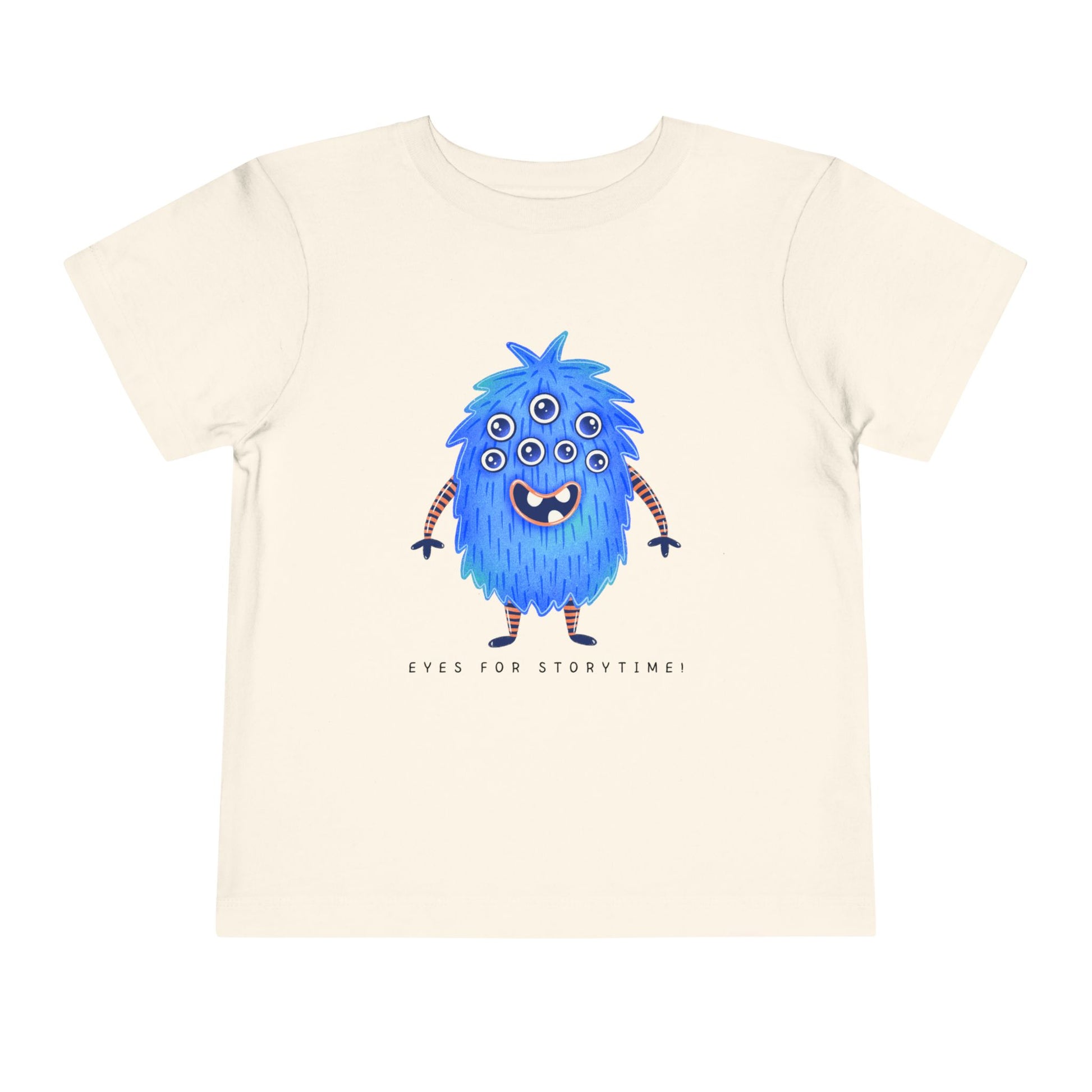 Beige toddler t-shirt with a blue multi-eyed cartoon monster and text 'eyes for storytime!'