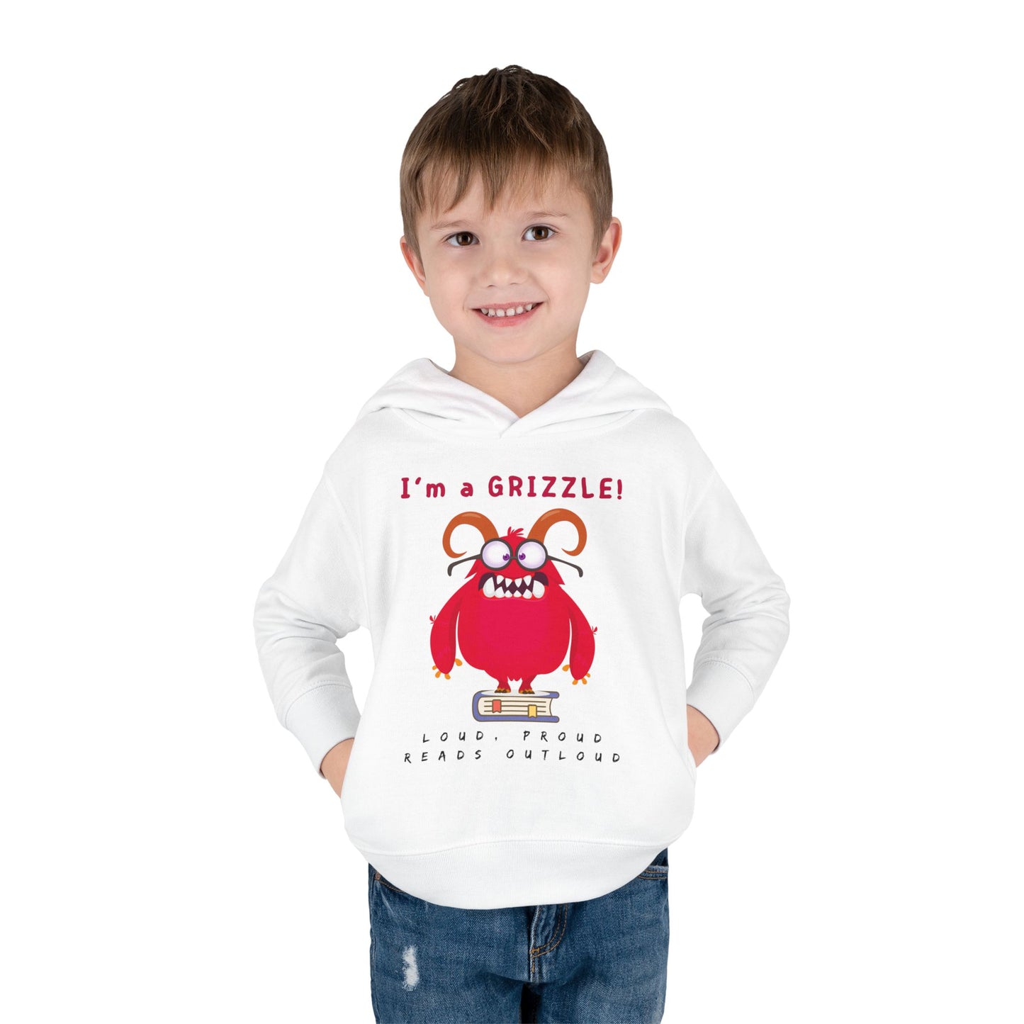 boy wearing a white toddler hoodie with a red monster standing on a book and text' I'm a Grizzle'