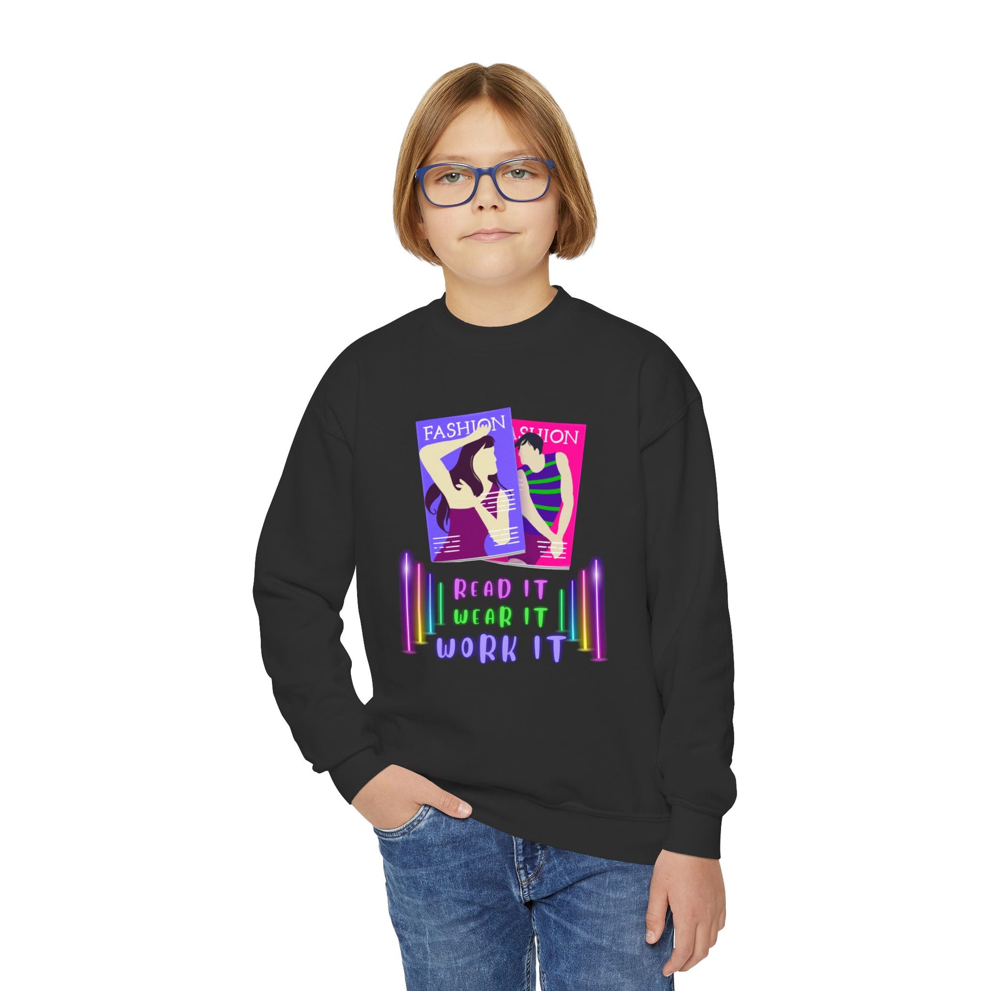 Boy wearing a black sweatshirt with colorful fashion magazine, neon lights and text 'Read It. Wear It. Work It.' 