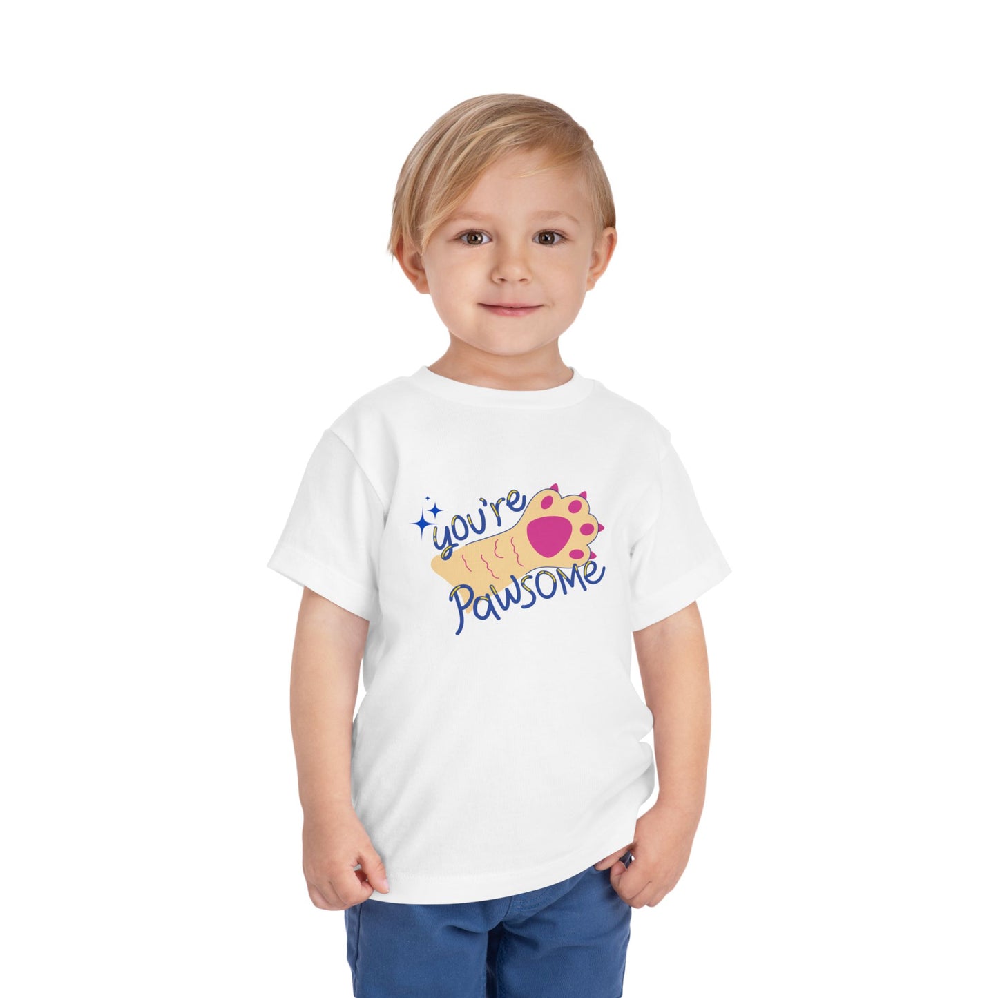 Toddler wearing a white t-shirt with 'you're pawsome' text and paw print design