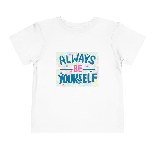 White toddler t-shirt featuring text 'Always Be Yourself' with a colorful pastel background