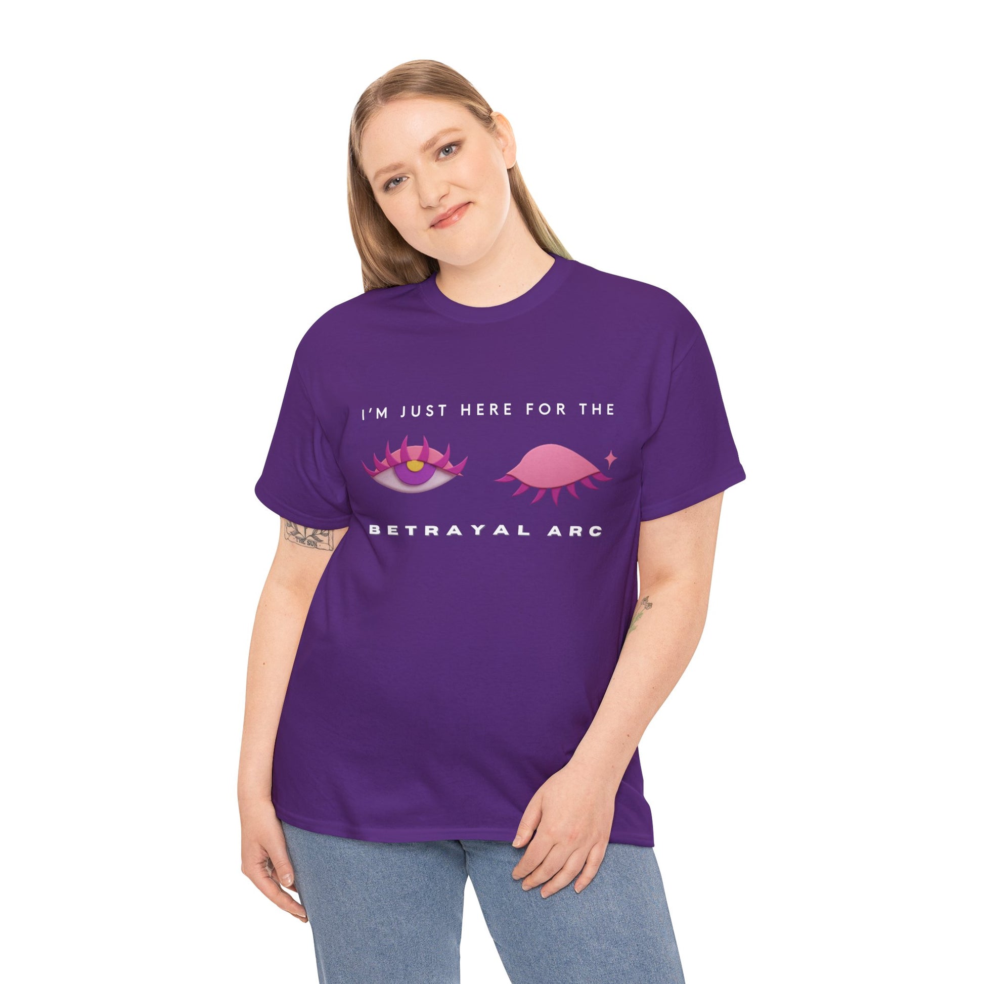 Woman wearing a purple t-shirt with a winking pink and purple eye graphic, with text 'I'm Just Here For The Betrayal Arc'