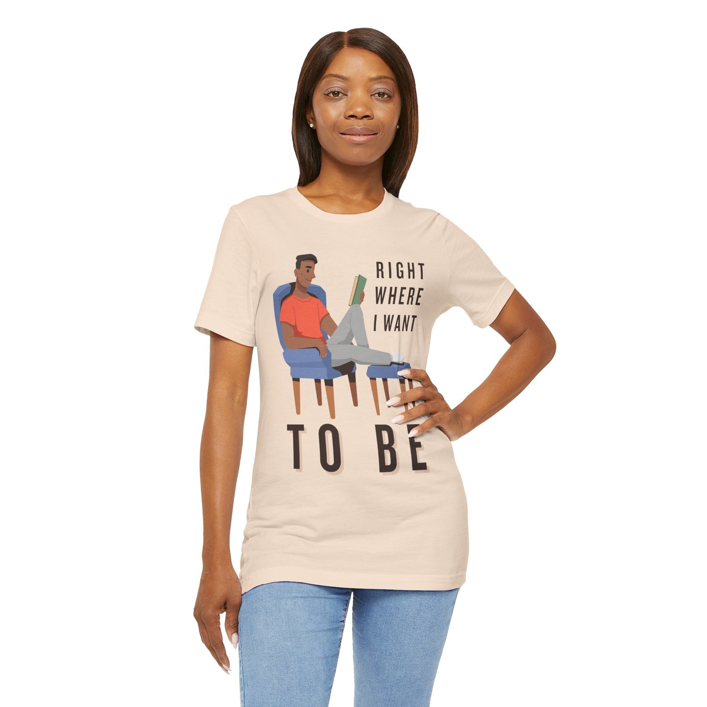 Woman wearing a beige t-shirt with a man lounging in a chair, feet up, book in hand and text 'Right Where I Want To Be'