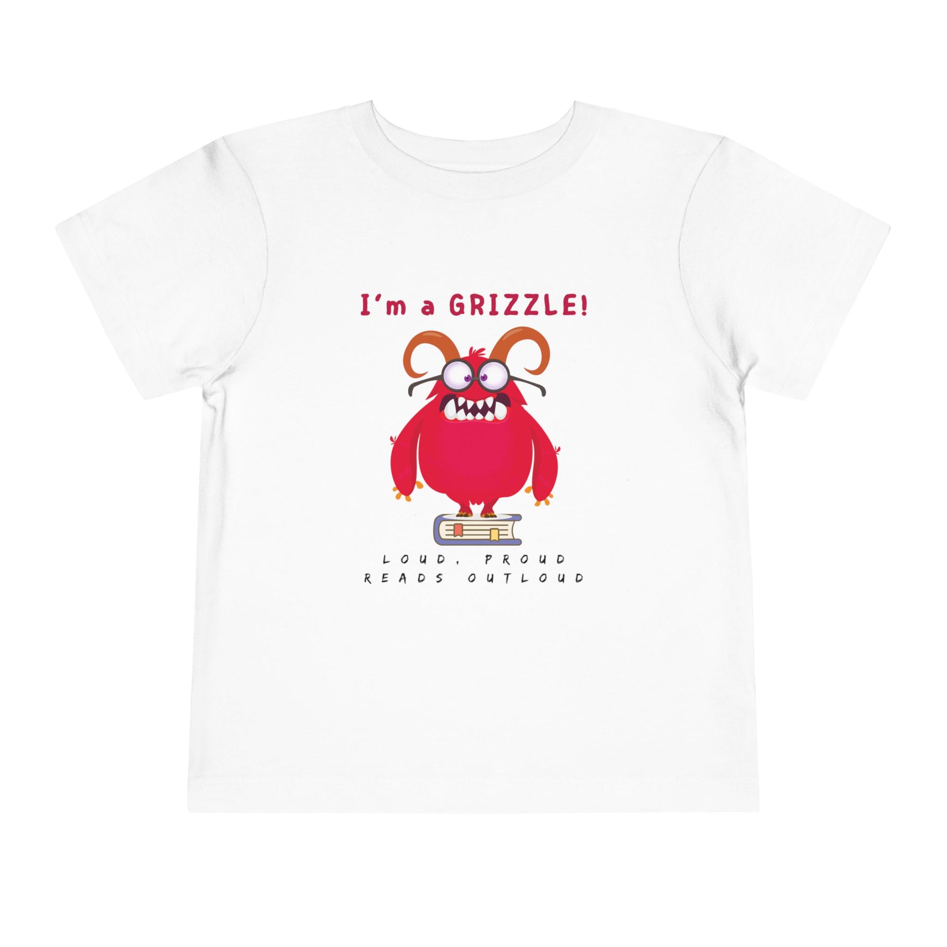White toddler personality t-shirt with a red monster graphic standing on a book proudly proclaiming 'I'm a GRIZZLE!' Sub-text 'Loud, Proud, Reads Aloud.'