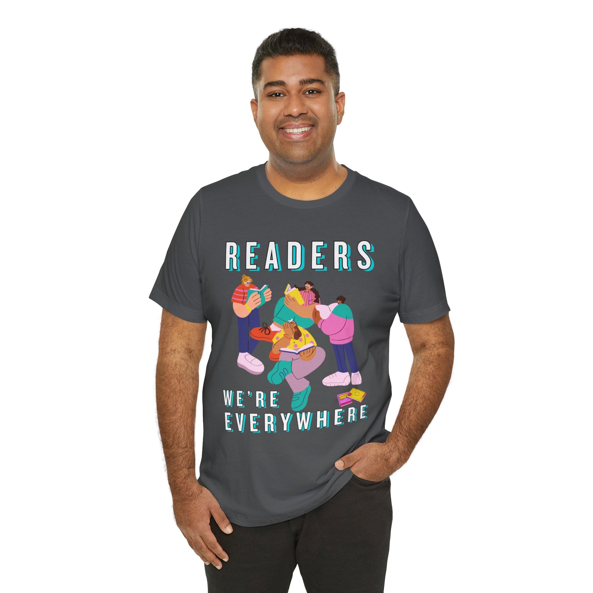 Man wearing a gray t-shirt with colorful modern shaped people reading books and text 'READERS WE'RE EVERYWHERE' 