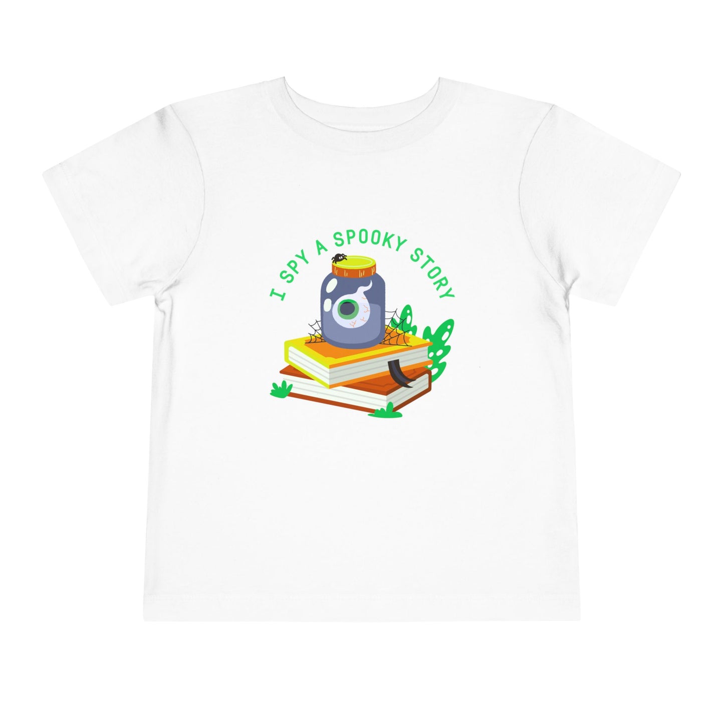 White toddler t-shirt with an eyeball in a yar on top of books and text 'I spy a spooky story' on a white background