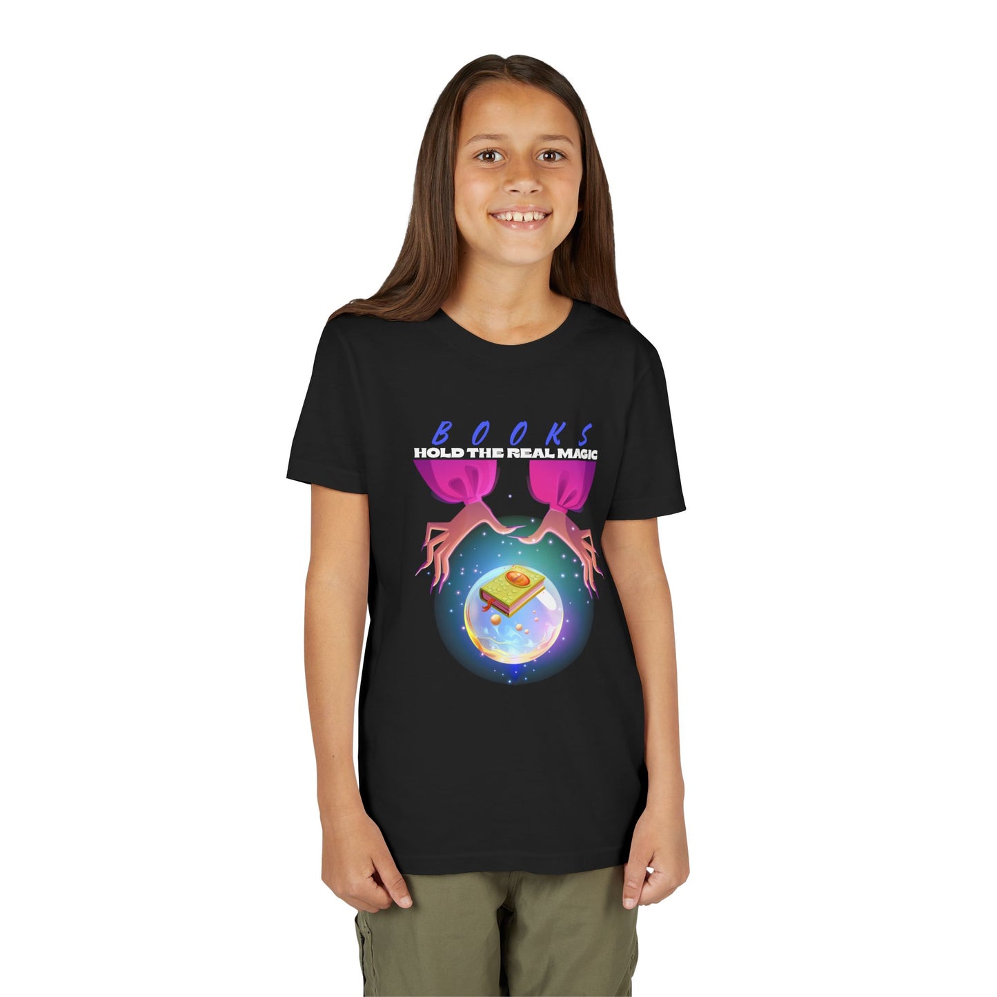 Girl wearing a black t-shirt with a hands around a crystal ball featuring a monster book and text 'Book Hold The Real Magic'