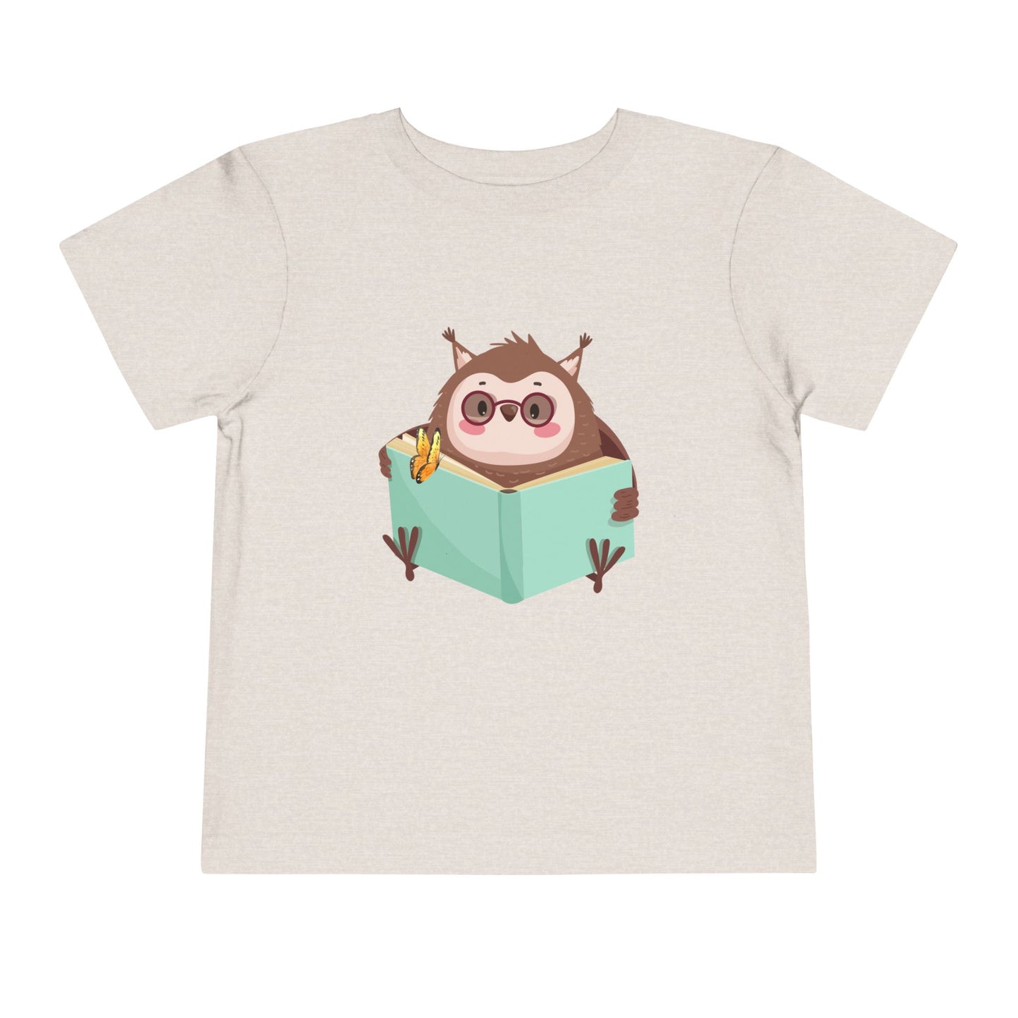 Beige toddler t-shirt with a cartoon own reading a book with a butterfly perched on top