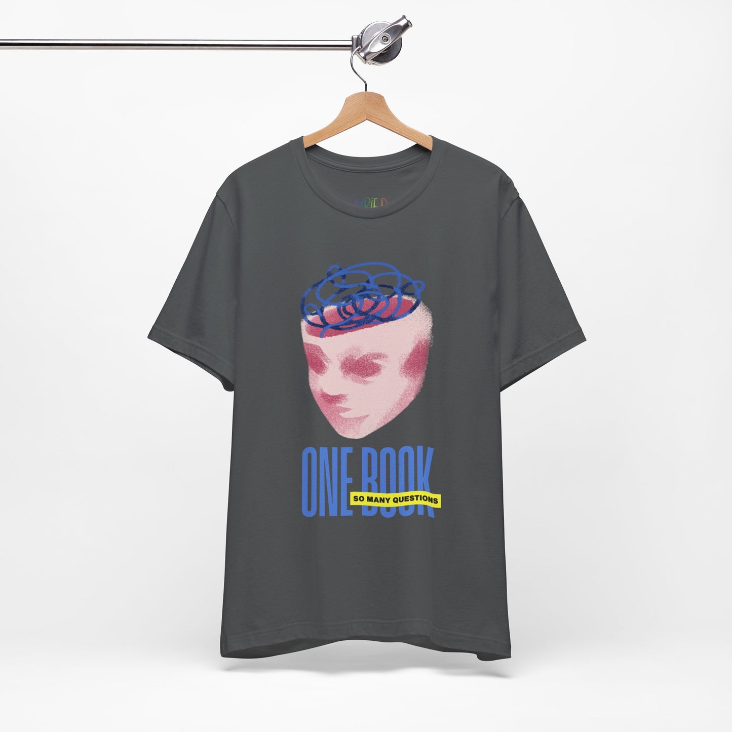 Gray t-shirt with a pink face/head graphic, blue swirls coming out of the top and text 'One Book So Many Questions'