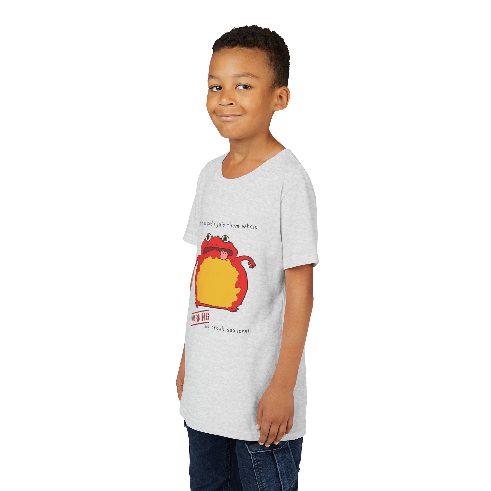 Boy wearing a light gray t-shirt with a toad and text 'tales so good I gulp them whole' and a warning 'may croak spoilers'
