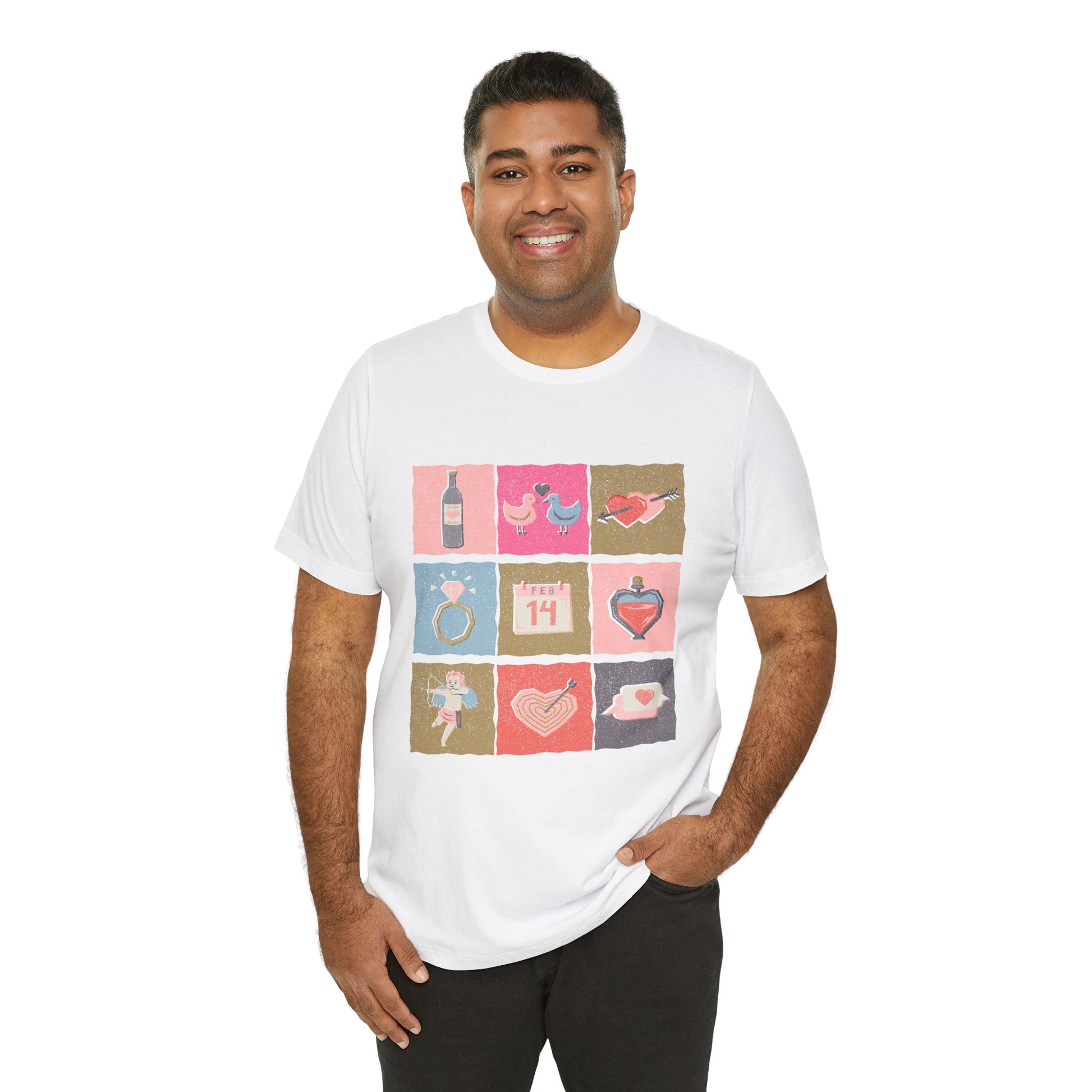 Man wearing a white t-shirt with colorful graphic design of Valentine's Day images stacked in blocks