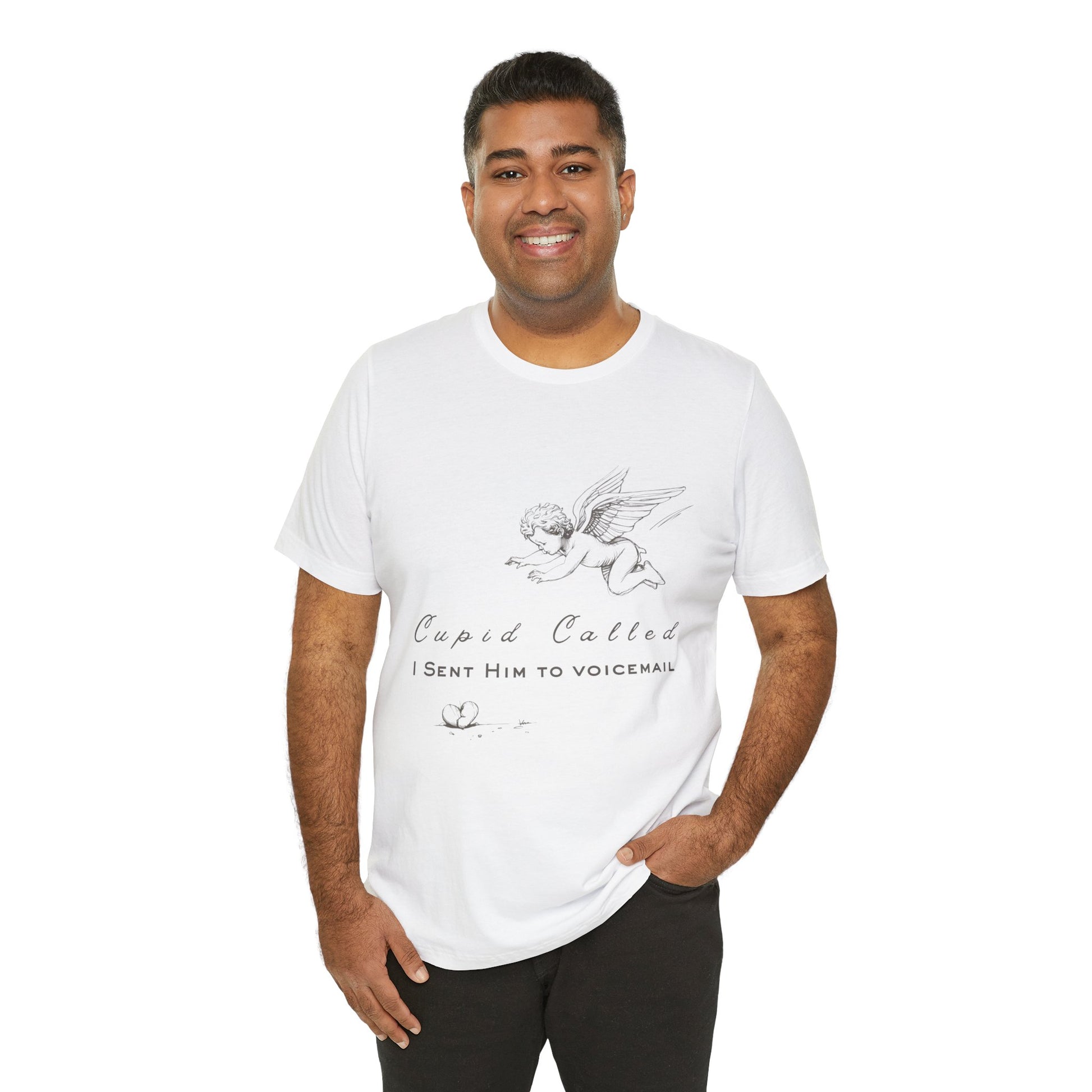 Man wearing a white t-shirt with cupid graphic design, a broken heart on the floor and text 'Cupid Called. I Sent Him To Voicemail.'