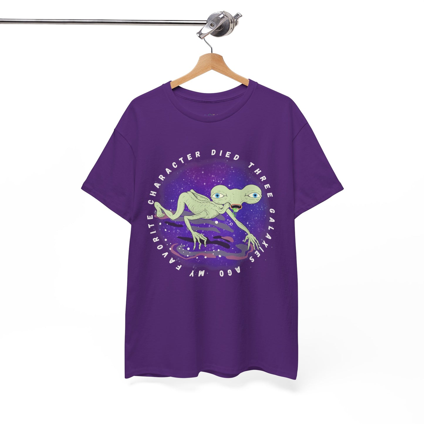 Purple t-shirt with sickly alien crawling on it's knees and text 'My Favorite Character Died Three Galaxies Ago' 