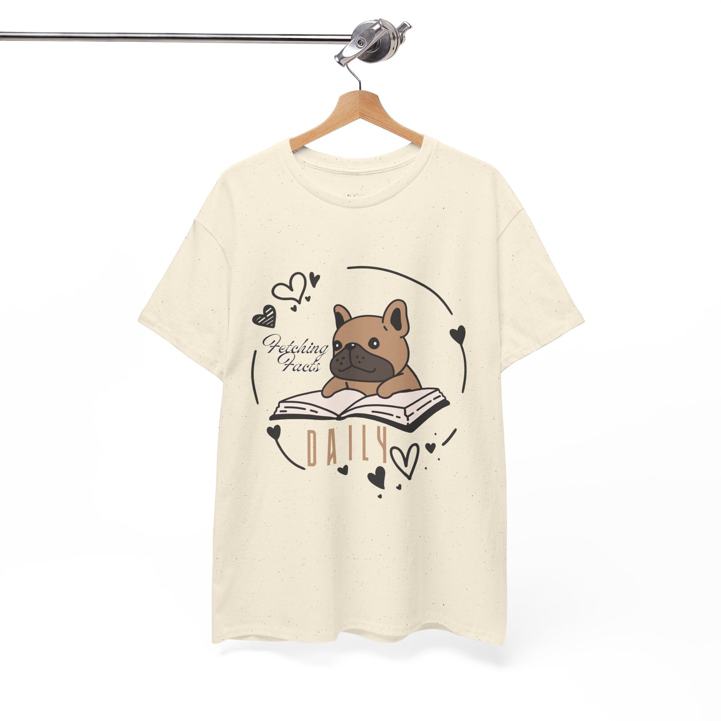 Beige t-shirt with a dog graphic reading a book and text 'Fetching Facts Daily, circled with hearts 