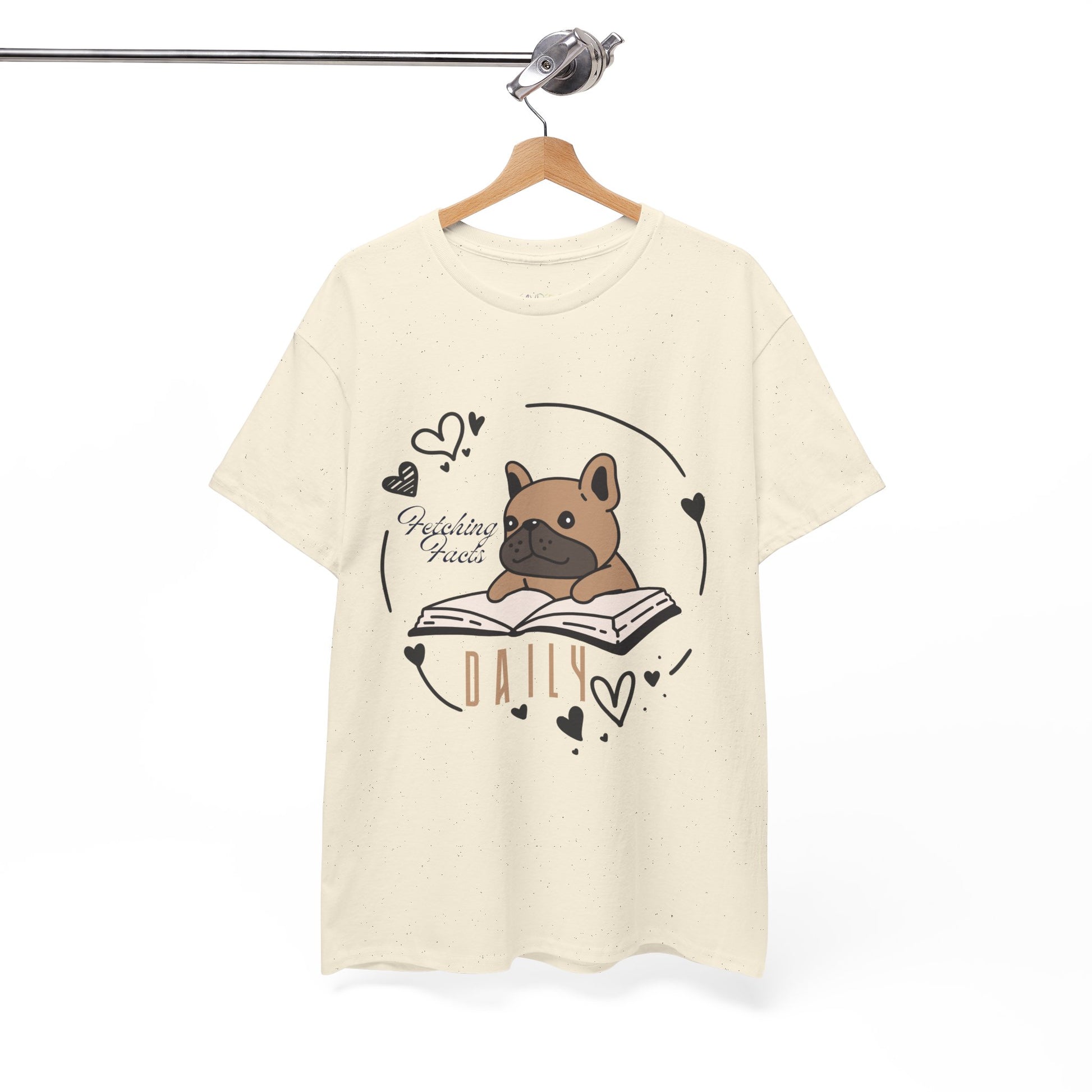 Beige t-shirt with a dog graphic reading a book and text 'Fetching Facts Daily, circled with hearts 