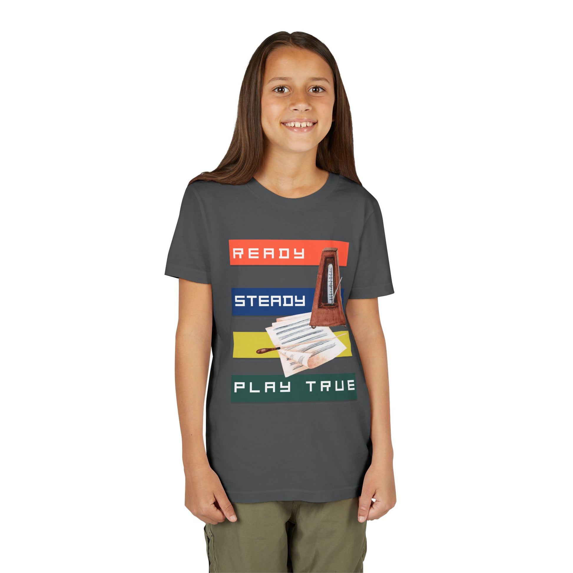 Girl wearing a gray t-shirt with colorful stripes, music sheets, a metronome and text 'Ready. Steady. Play True.'