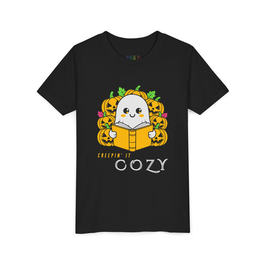 Black t-shirt with a ghost reading a book in a pumpkin patch with text 'Creepin' It Cozy'