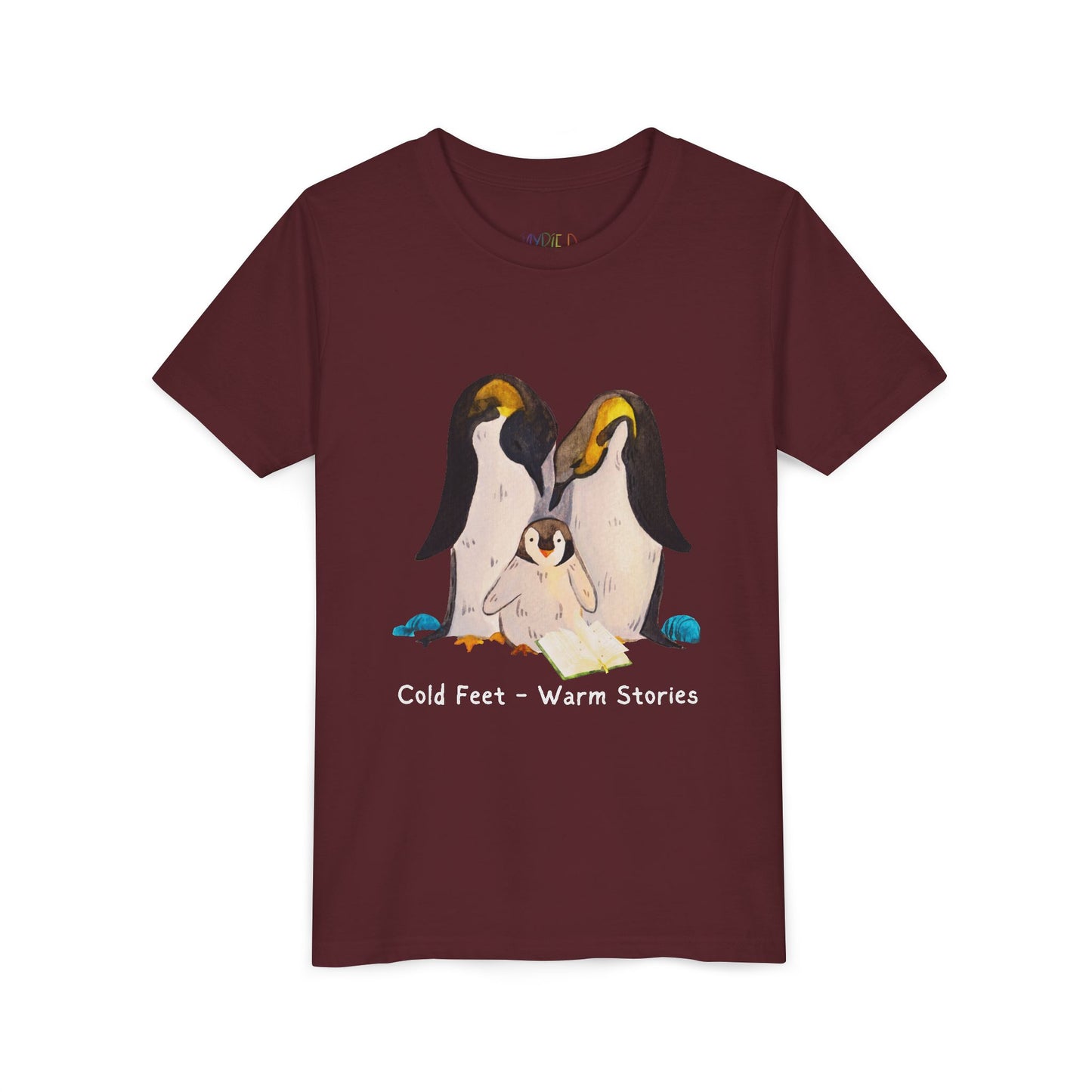 Maroon t-shirt with a penguin family, open book and text 'Cold Feet - Warm Stories'