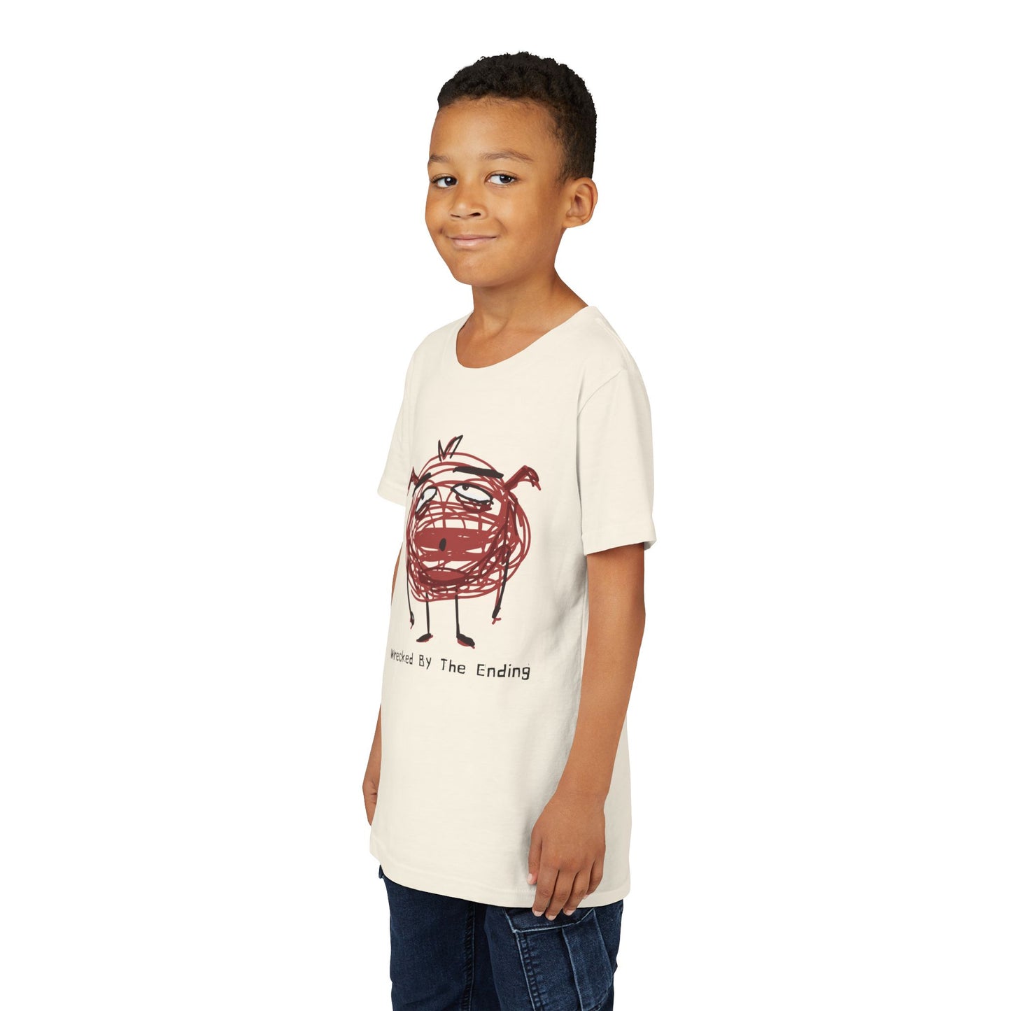 Boy wearing a beige t-shirt with a red scribbled character and text 'wrecked by the ending'